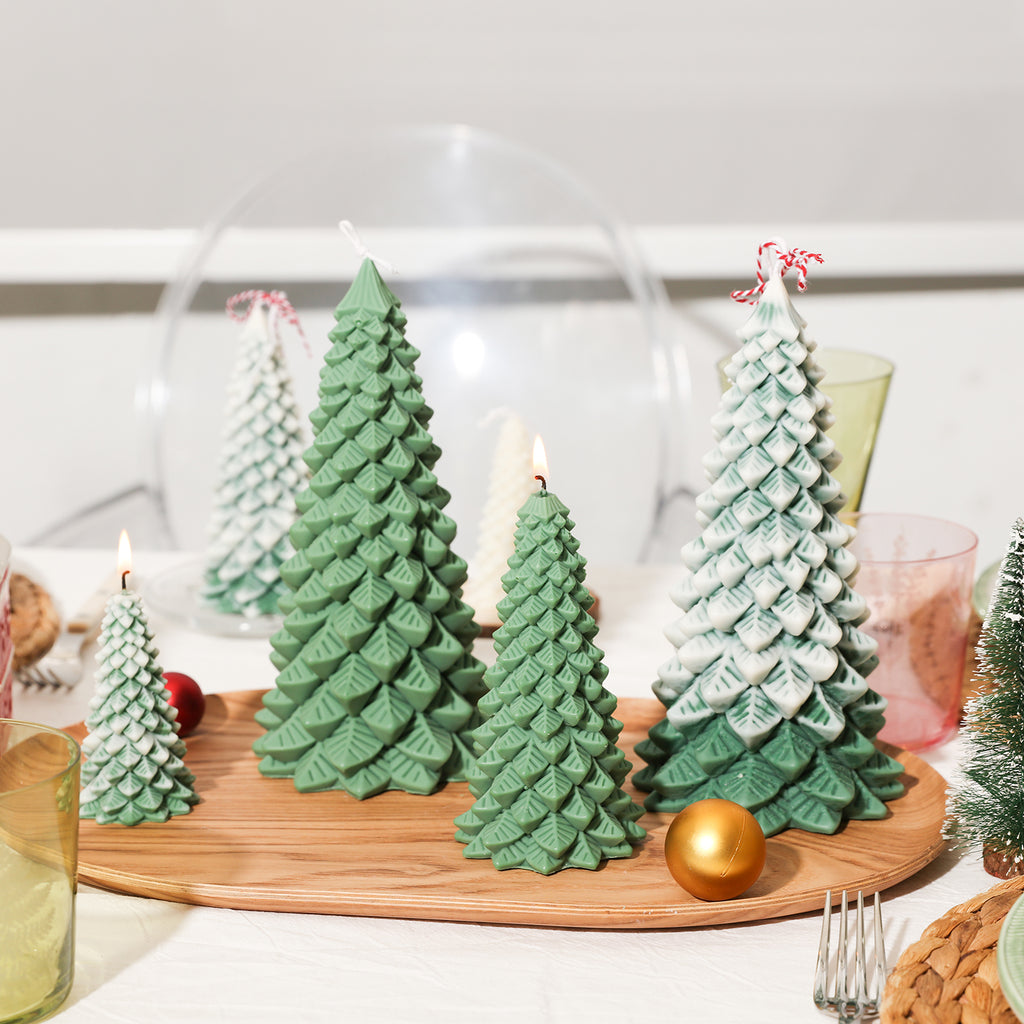 Christmas pine candles of different sizes placed on a wooden tray on the table - Boowan Nicole