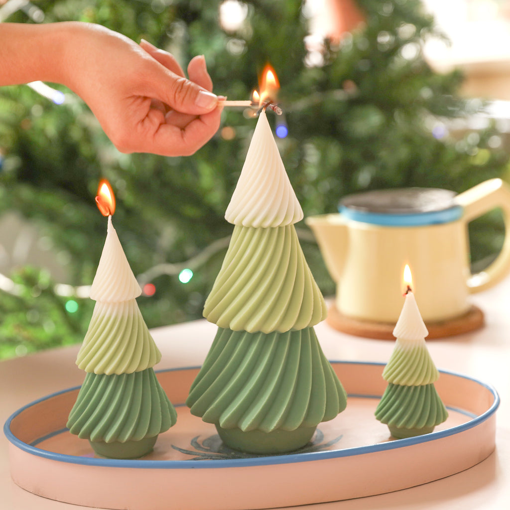 Light the evergreen Christmas tree candles in the tray - Boowan Nicole.