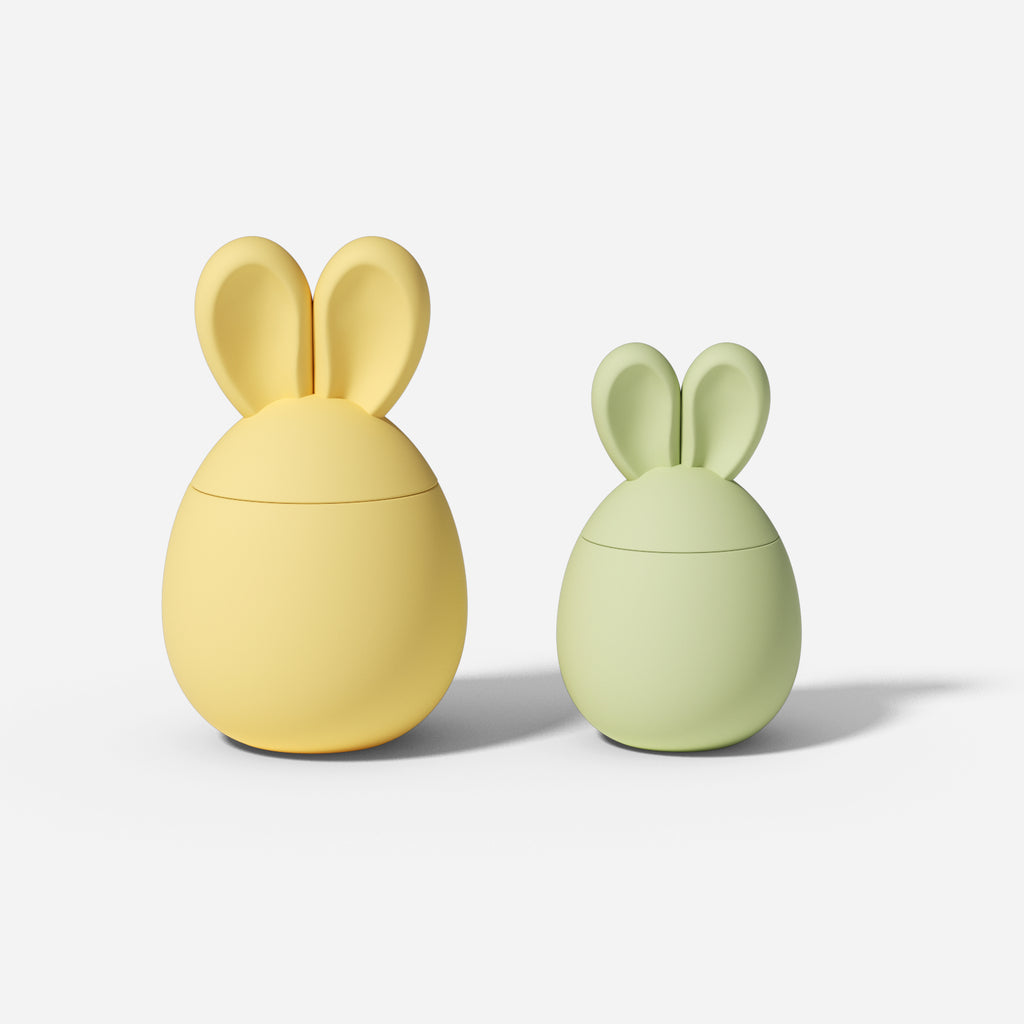 Two Easter bunny candle jars, one large and one small