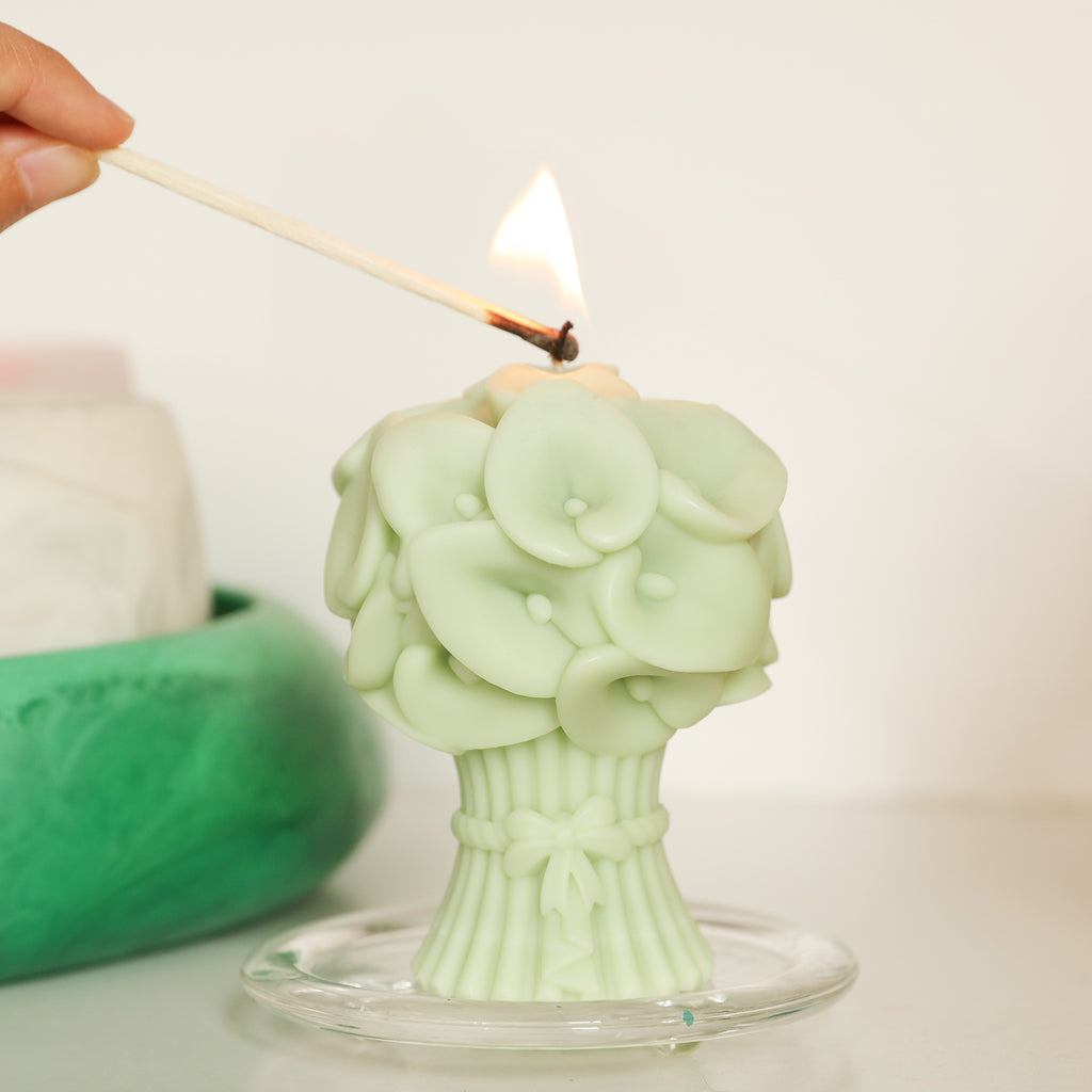 Light the green Calla Lily Bouquet Flourishing Candle in the crystal tray on the table -Boowan Nicole