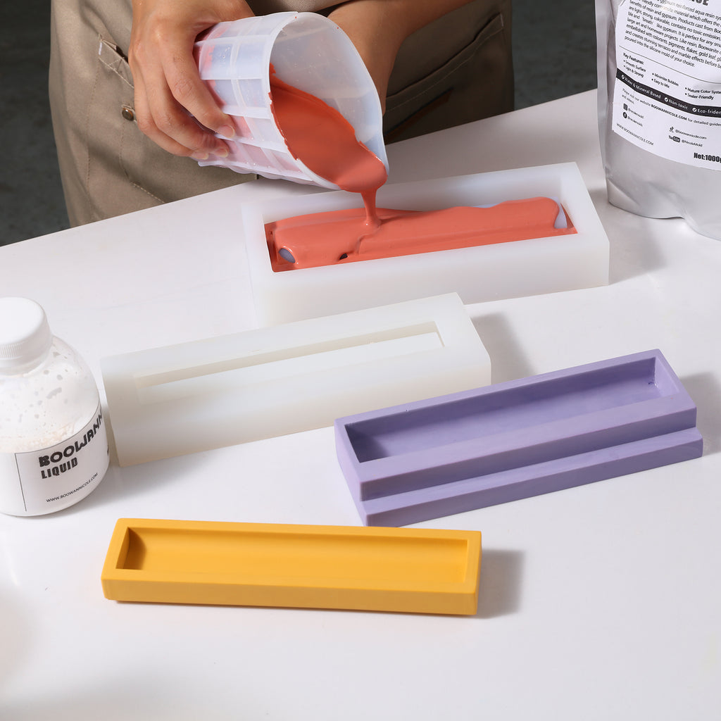 Pour red boowannite material into white silicone mold to make Staircase Pen Holder-Boowan Nicole