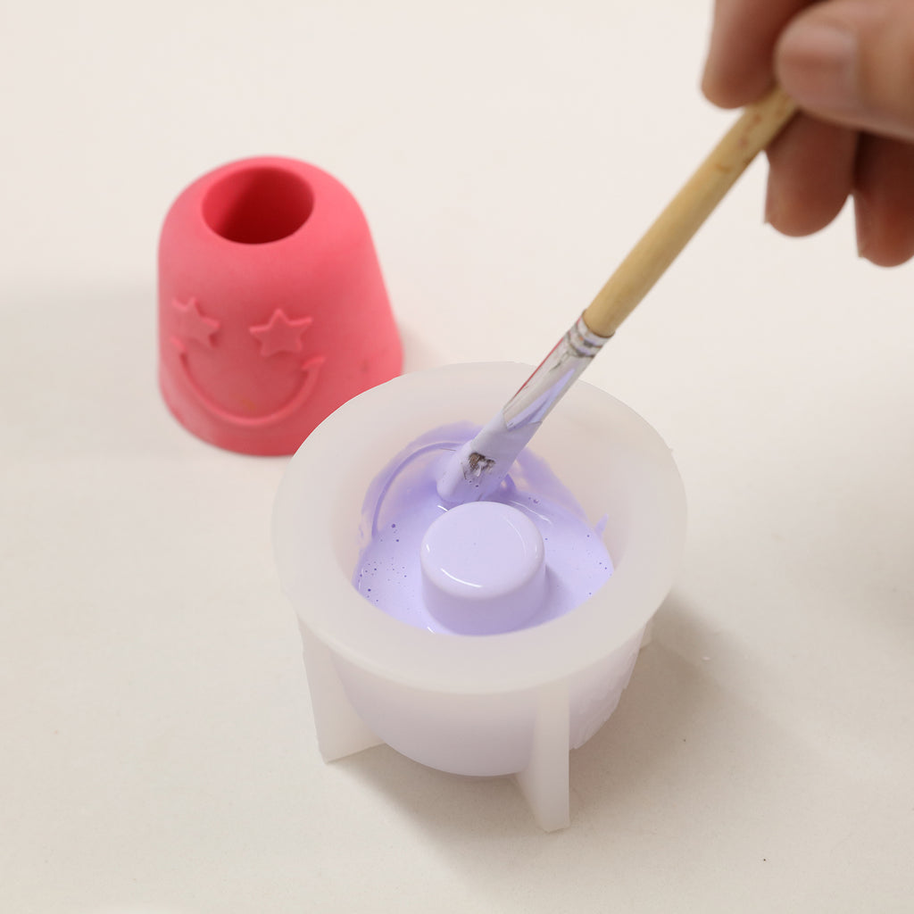 Use a brush to remove air bubbles from the Pen & Toothbrush Holder Silicone Mold-Boowan Nicole