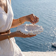 Woman holding finished Ocean Wave Serenity Tray by the sea, placing jewelry - Boowan Nicole