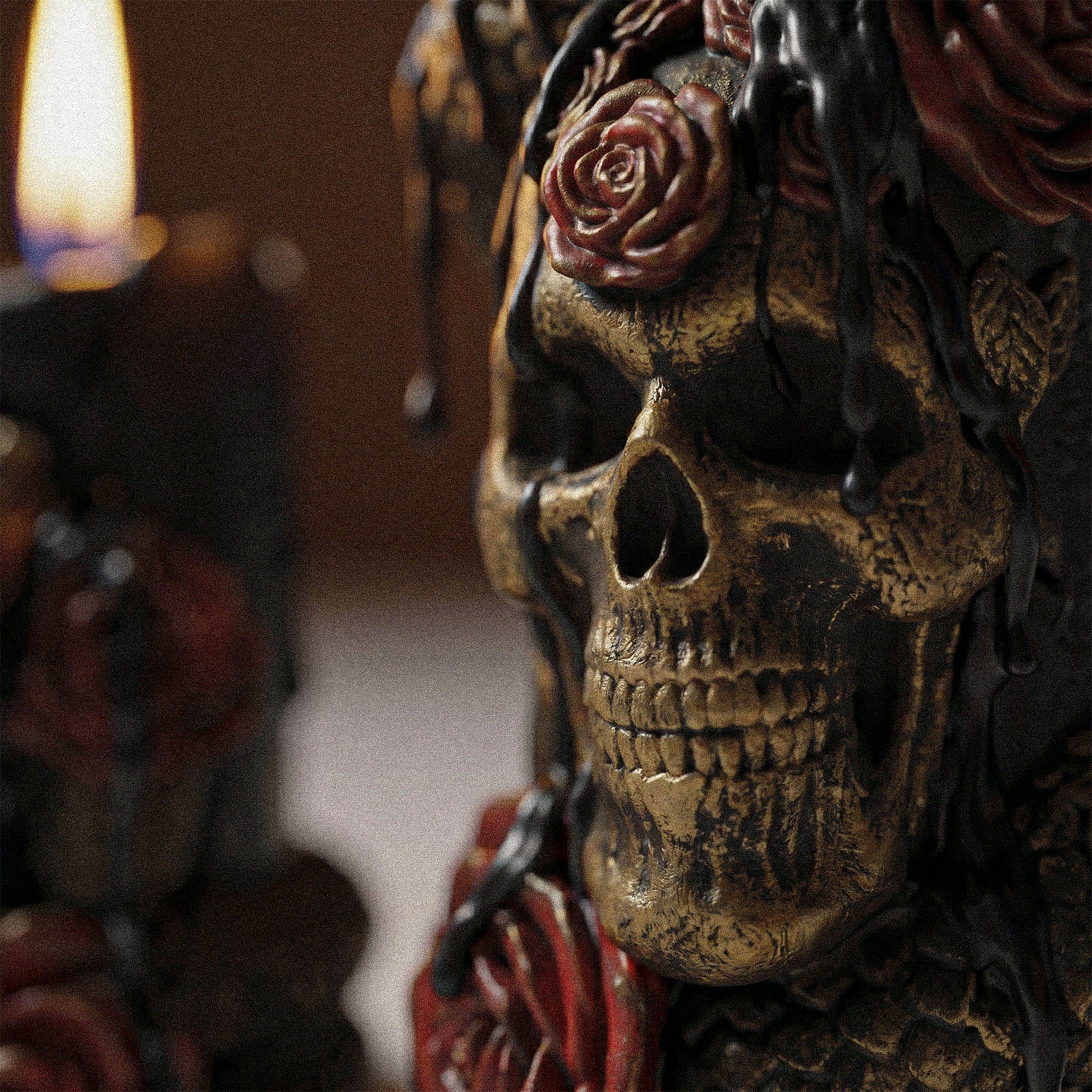 Close-up shot of skull, serpent and red rose sculpt detail on Venom & Roses pillar candle dark goth texture focus - Boowan Nicole