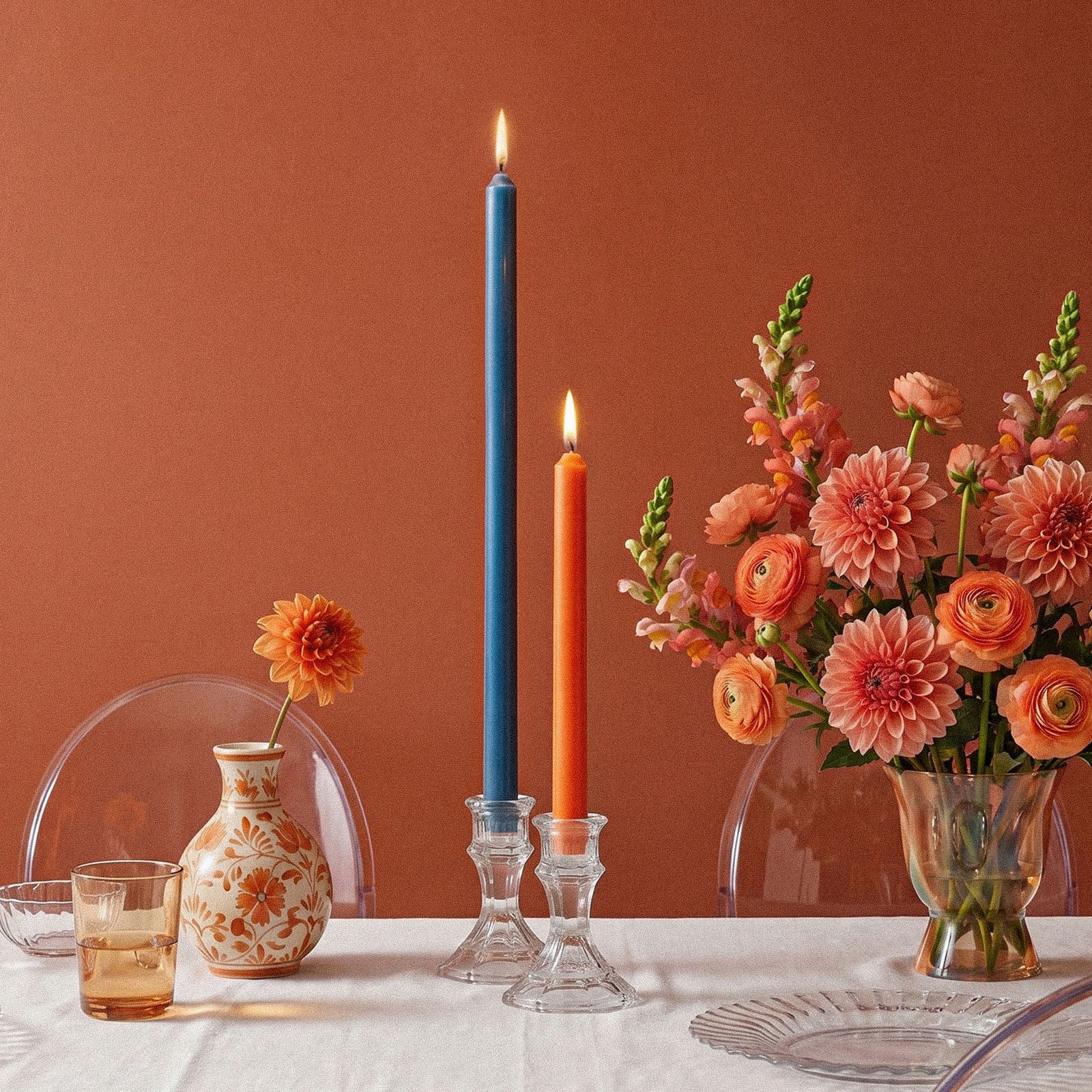 Lit Tall Slim Taper Candles on Dining Table with Floral Decor - Boowan Nicole