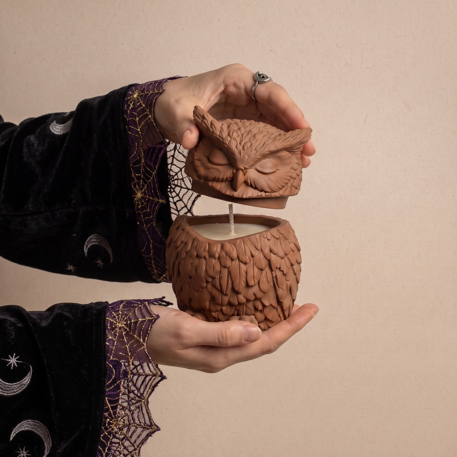Hands lifting the sculpted owl lid off the empty owl‑shaped candle jar vessel - Boowan Nicole