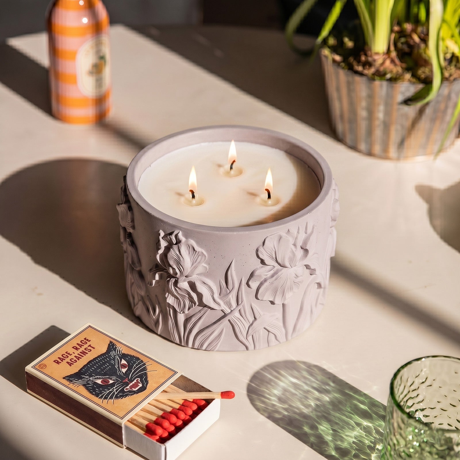 Iris Embossed Candle Jar Silicone Mold, lit purple candle jar with matches on table - Boowan Nicole