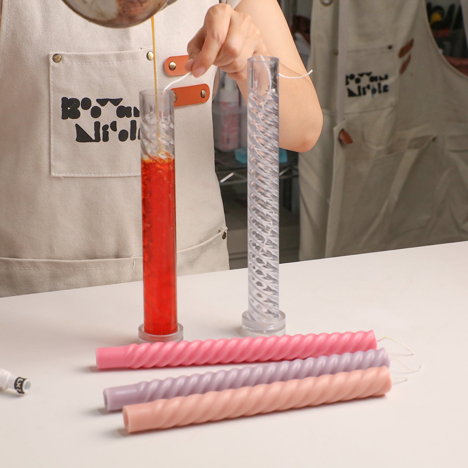 Pouring Melted Wax into Twist Taper Acrylic Candle Molds - Boowan Nicole