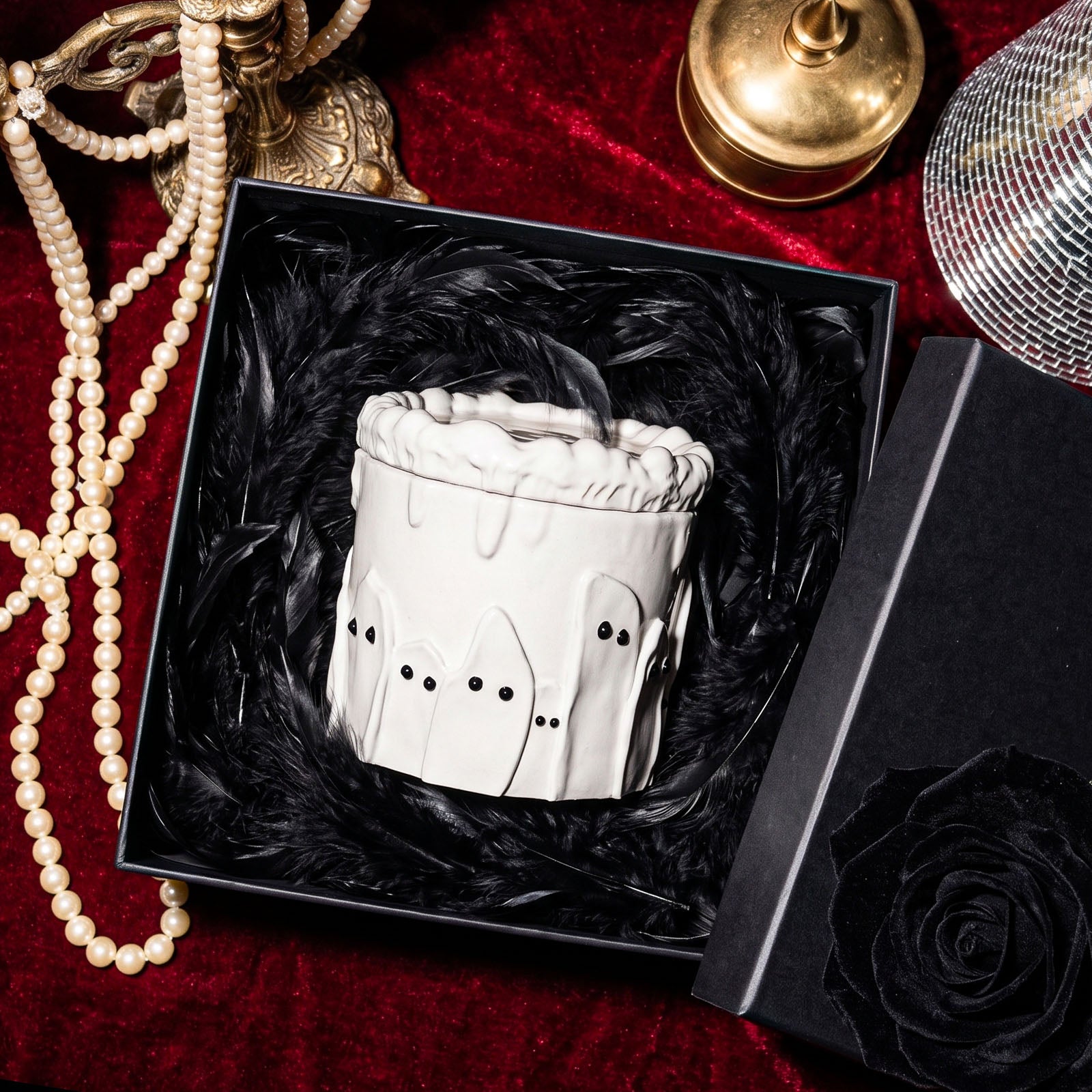 White ghostly cake candle jar packed in black gift box lined with fluffy black feathers - Boowan Nicole