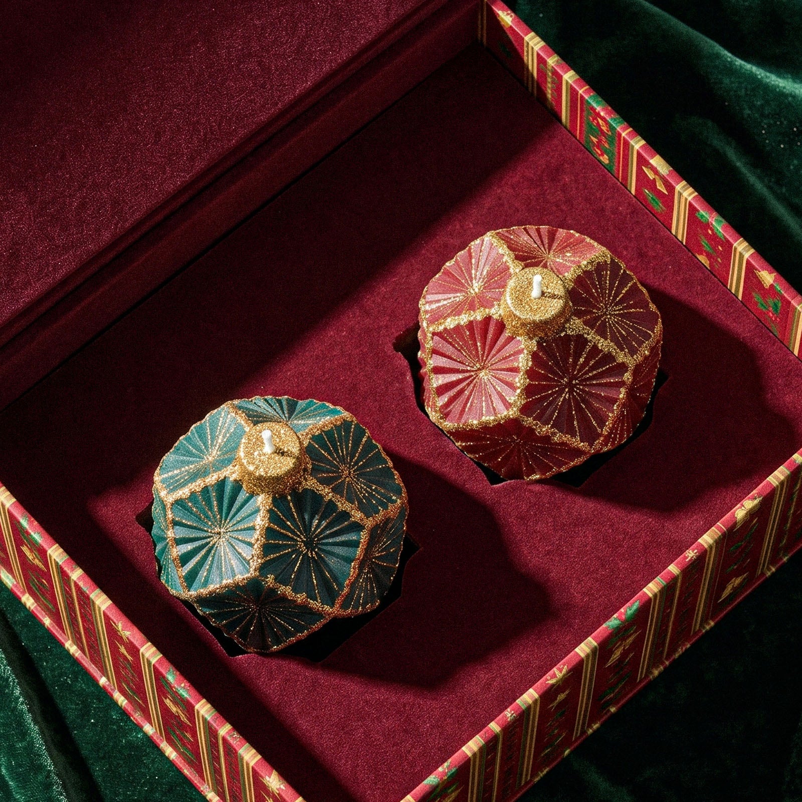 Green and red ornament ball candles arranged inside luxury festive gift box with velvet lining - Boowan Nicole
