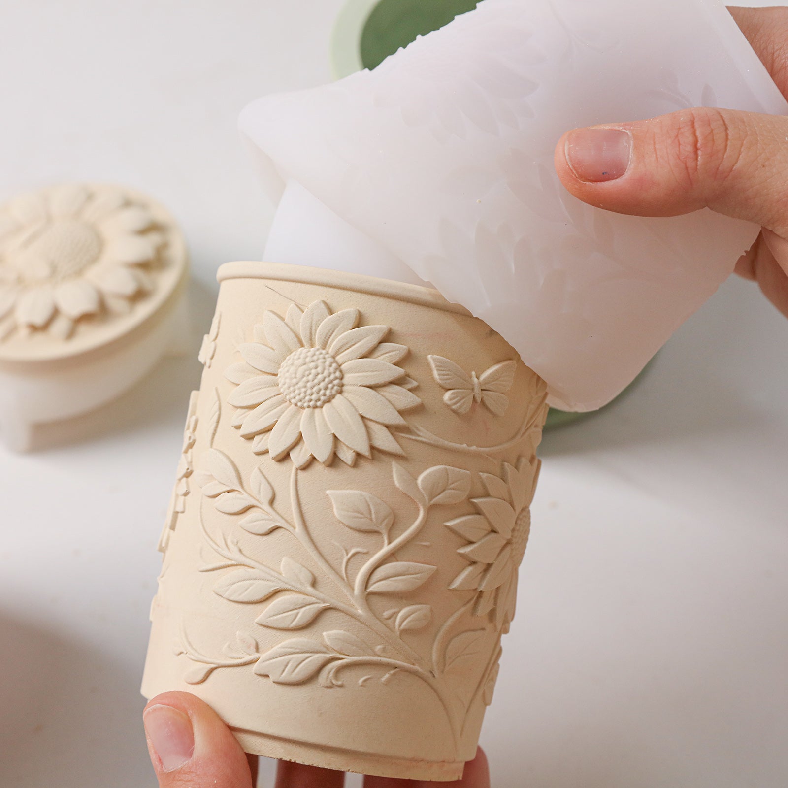 Sunflower Embossed Candle Jar Silicone Mold, unmolding finished beige candle jar from clear mold - Boowan Nicole