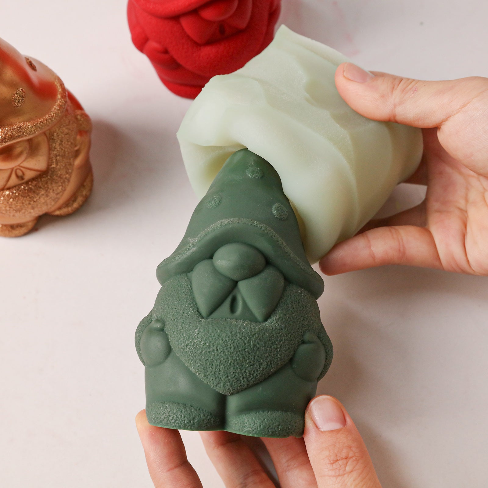 Demolding finished green textured gnome candle from flexible silicone mold - Boowan Nicole