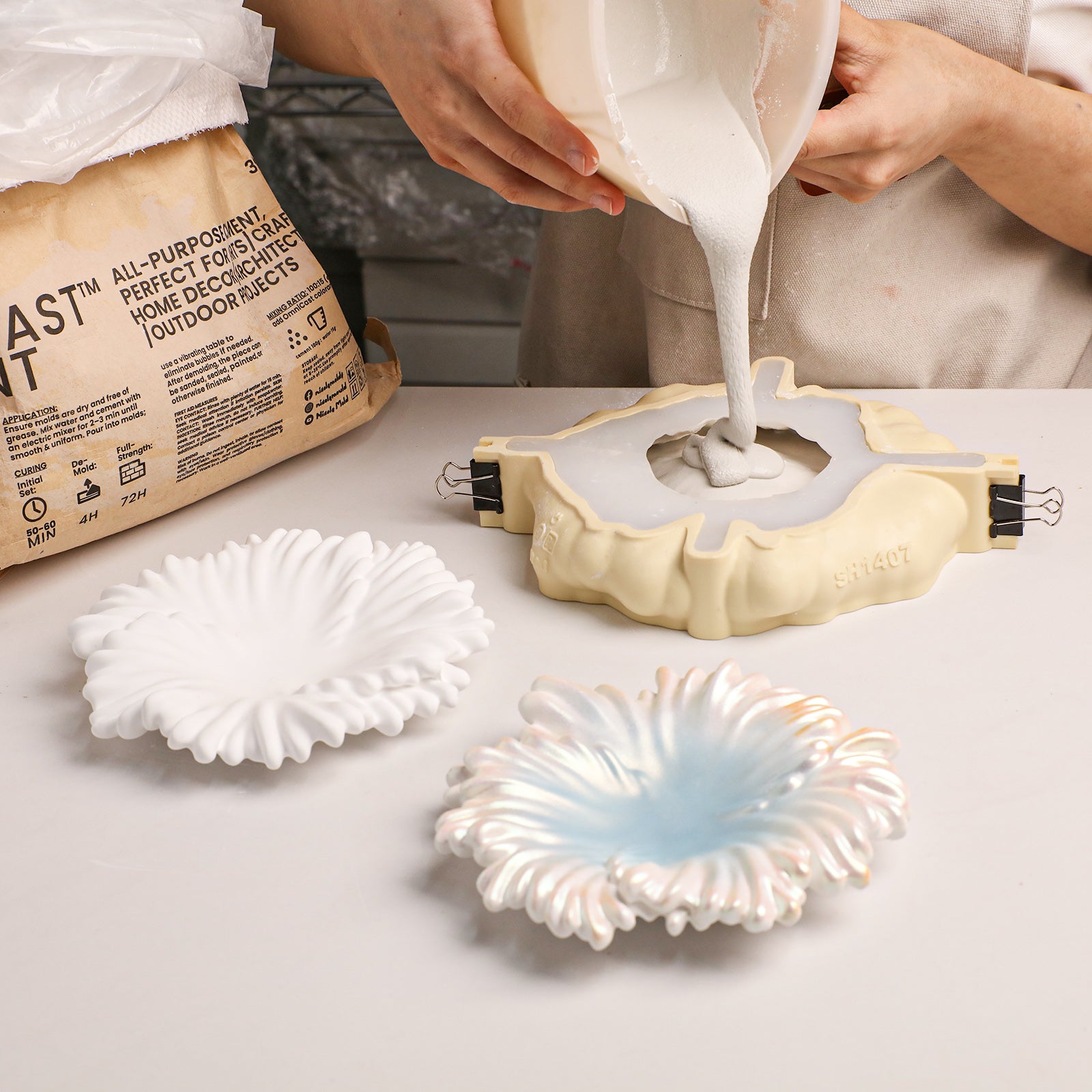 Pouring plaster into Ocean Wave Serenity Tray silicone mold during crafting - Boowan Nicole