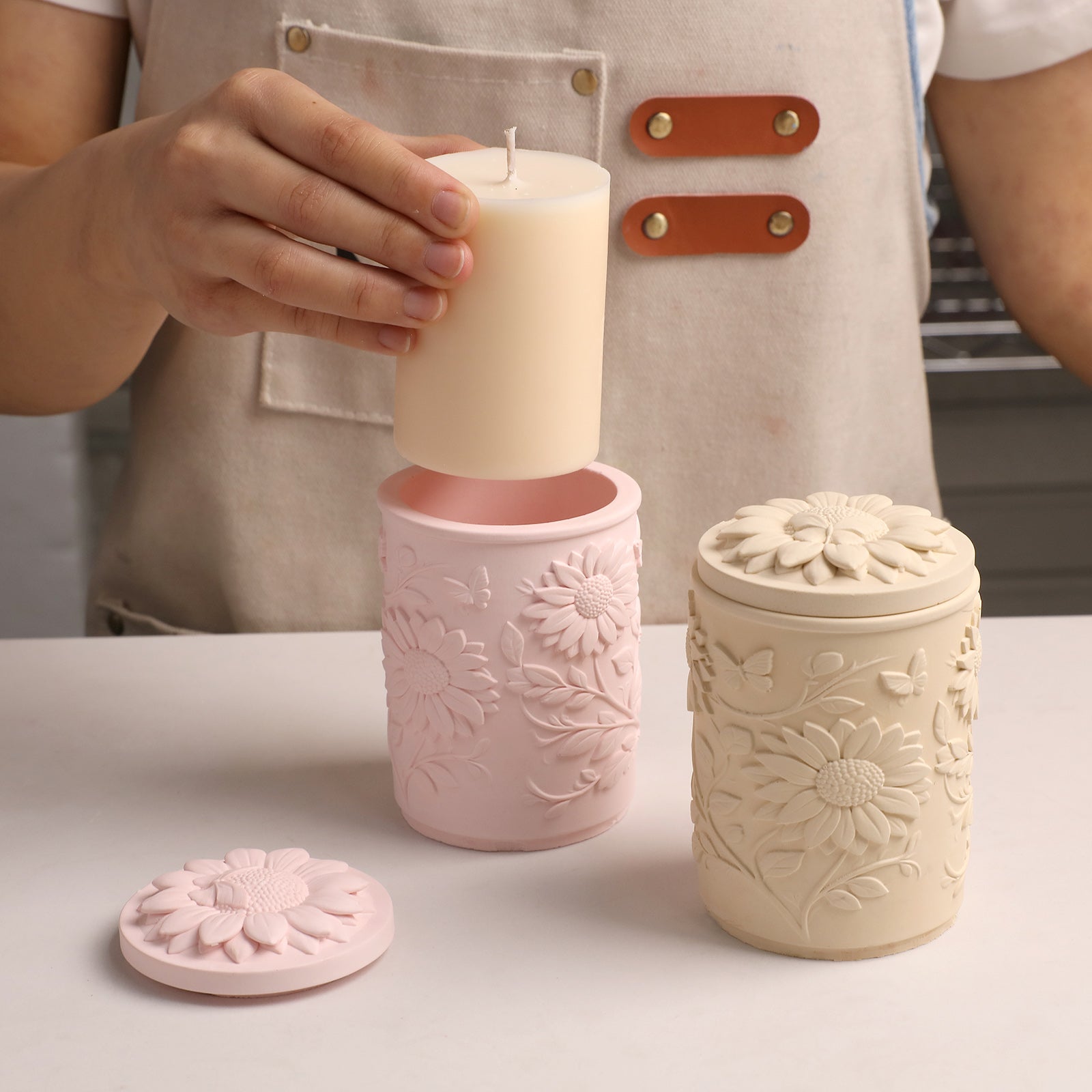 Sunflower Embossed Candle Jar Silicone Mold, placing candle into finished pink candle jar with lid - Boowan Nicole