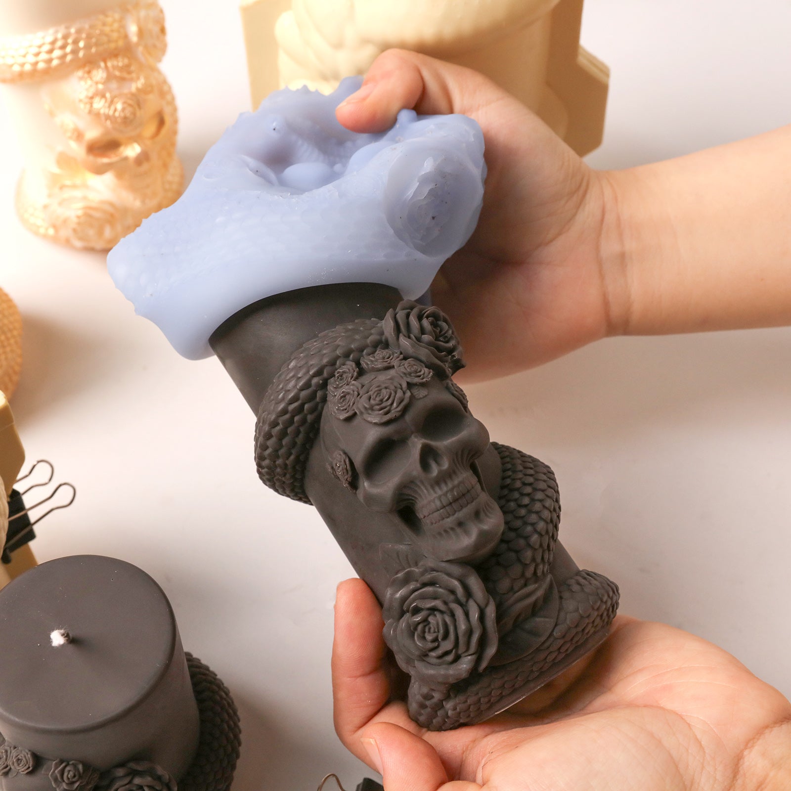 Demolding dark grey Venom & Roses skull serpent pillar candle blank from flexible silicone handmade mold - Boowan Nicole
