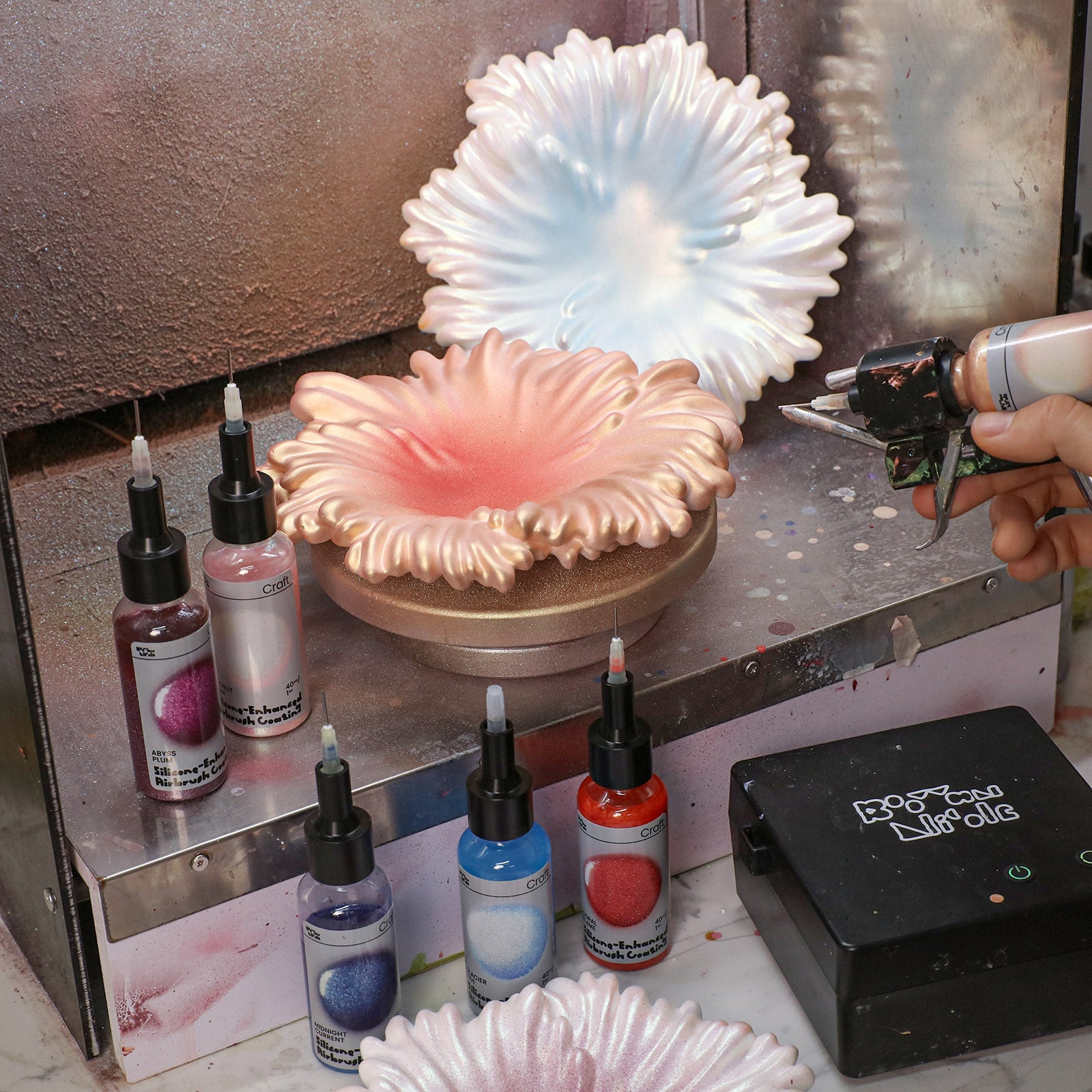 Airbrushing iridescent colors on Ocean Wave Serenity Trays - Boowan Nicole