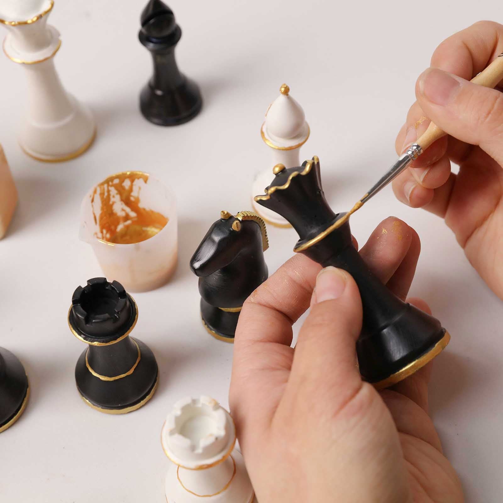 Hand Painting Gold Accents on Black Chess Pieces - Boowan Nicole
