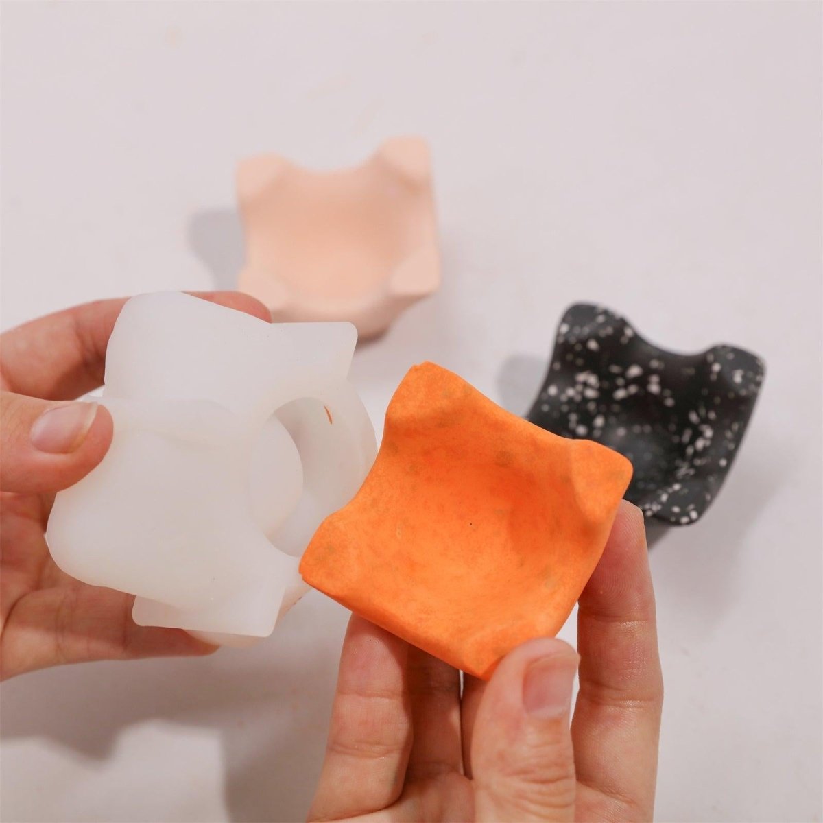 Demold the finished orange terrazzo 1 Cavityegg holder from the silicone mold - Boowan Nicole