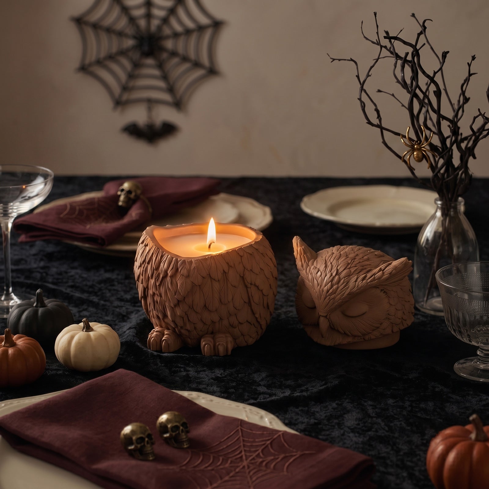 Lit candle inside owl‑shaped jar, Halloween gothic dark table setting scene display - Boowan Nicole