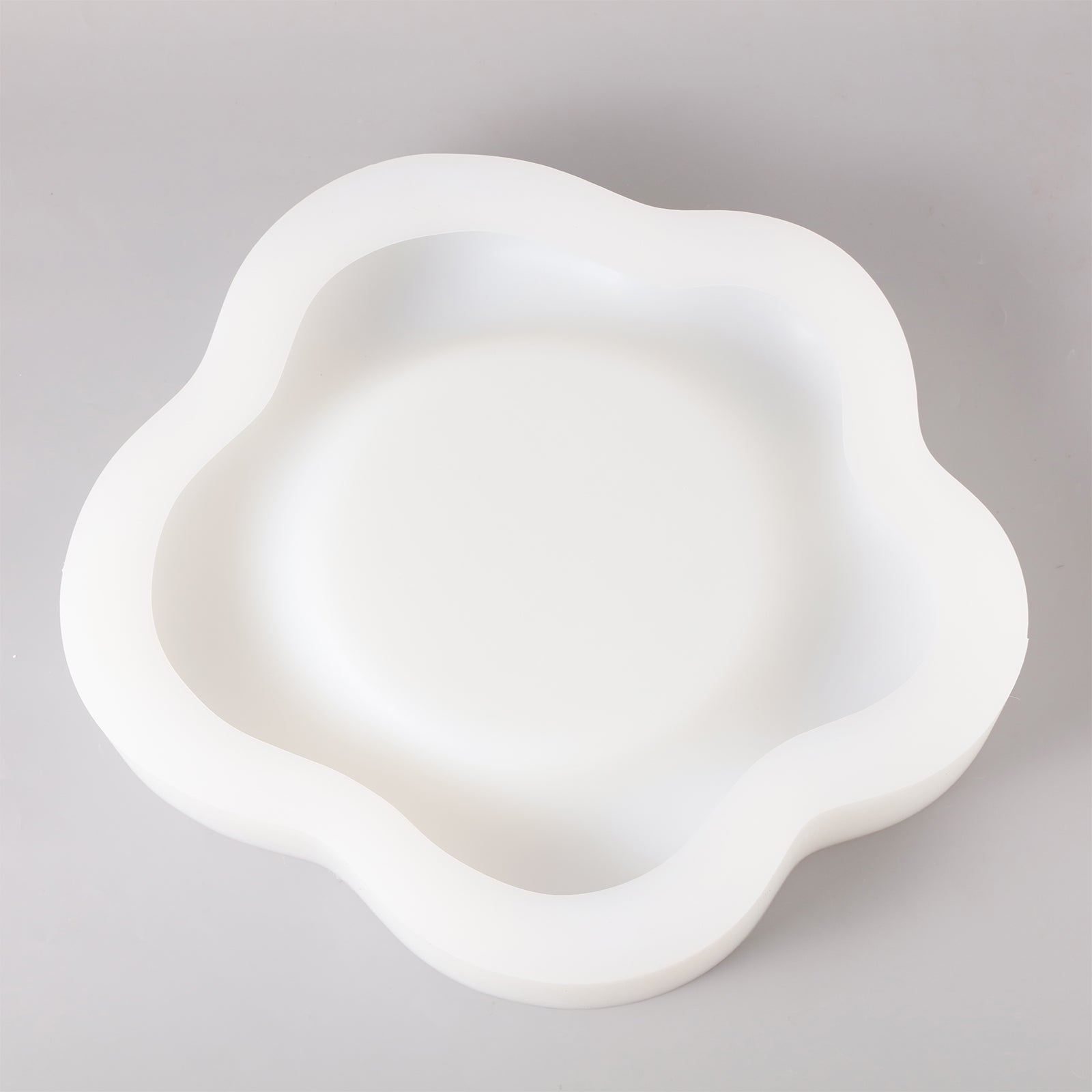 Silicone molds for making large flower trays.