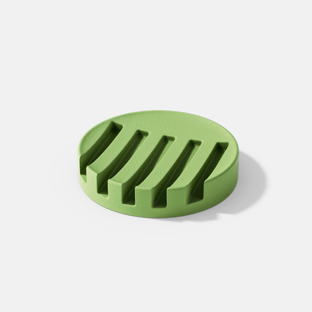 Showcasing a green concrete soap dish crafted with boowannicole's silicone mold, highlighting the brand's unique design.