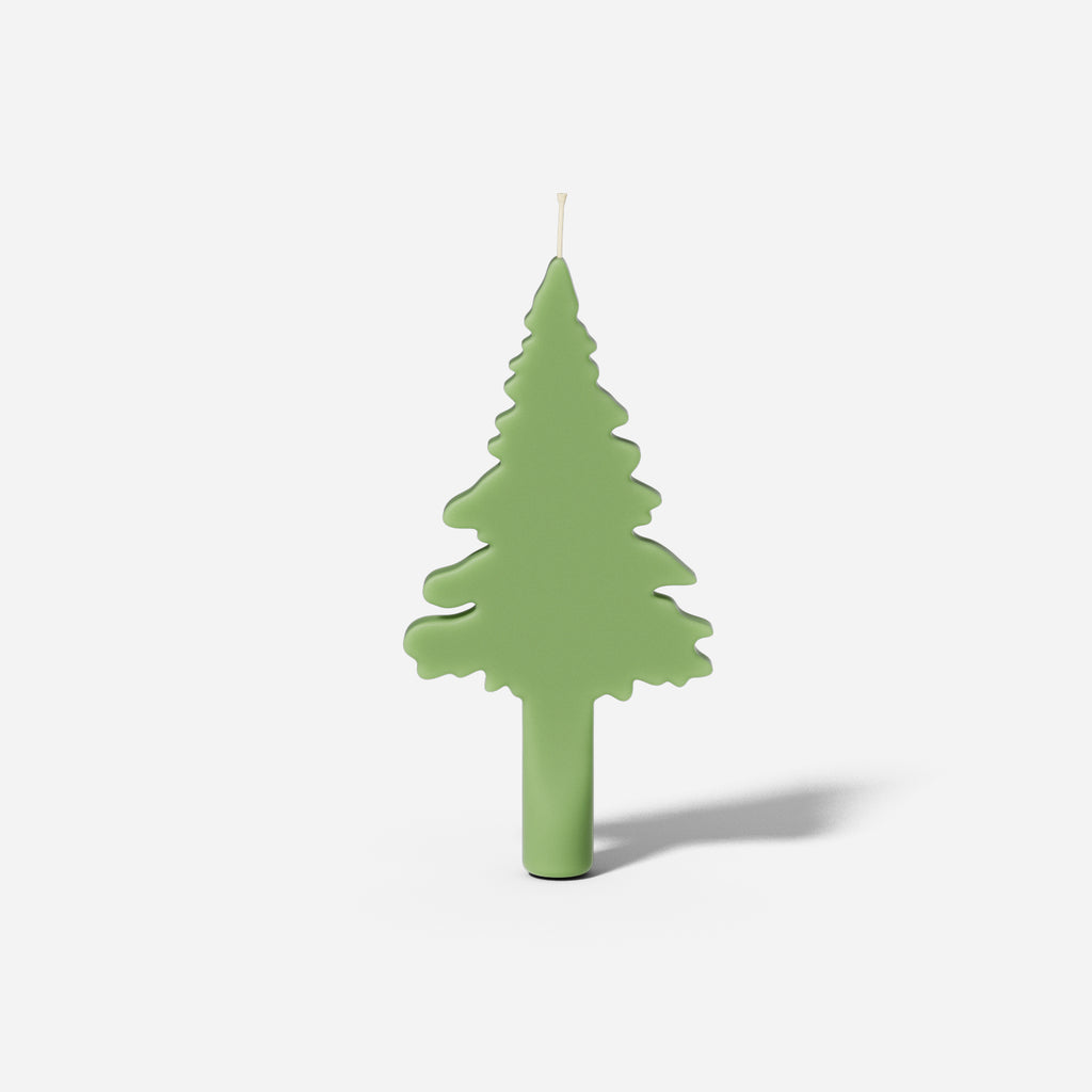 Christmas evergreen tree silhouette taper candle made using a silicone mold designed by Boowan Nicole.