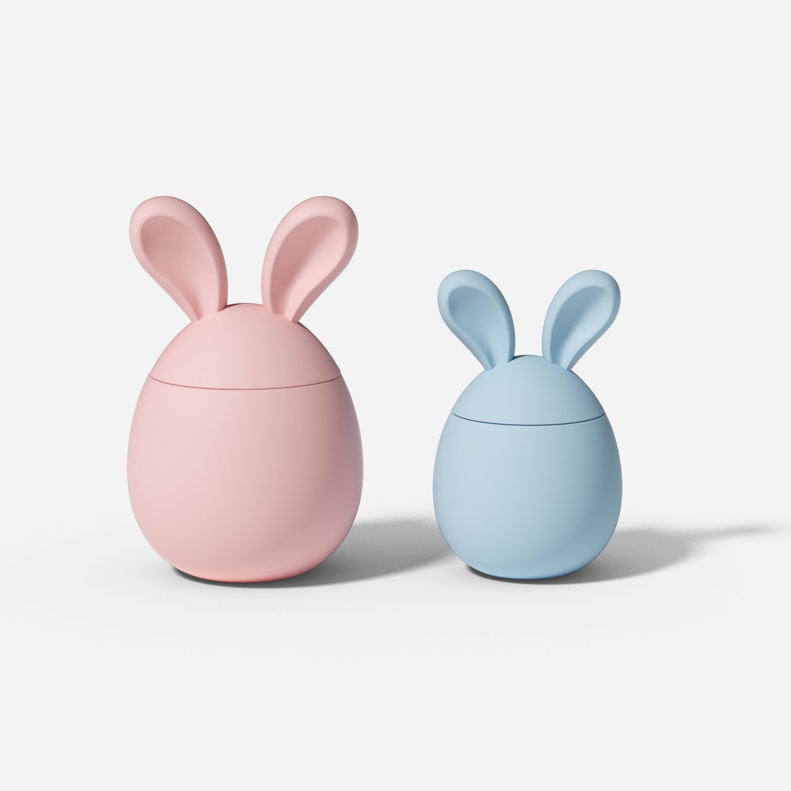 Two Easter bunny candle jars, one large and one small