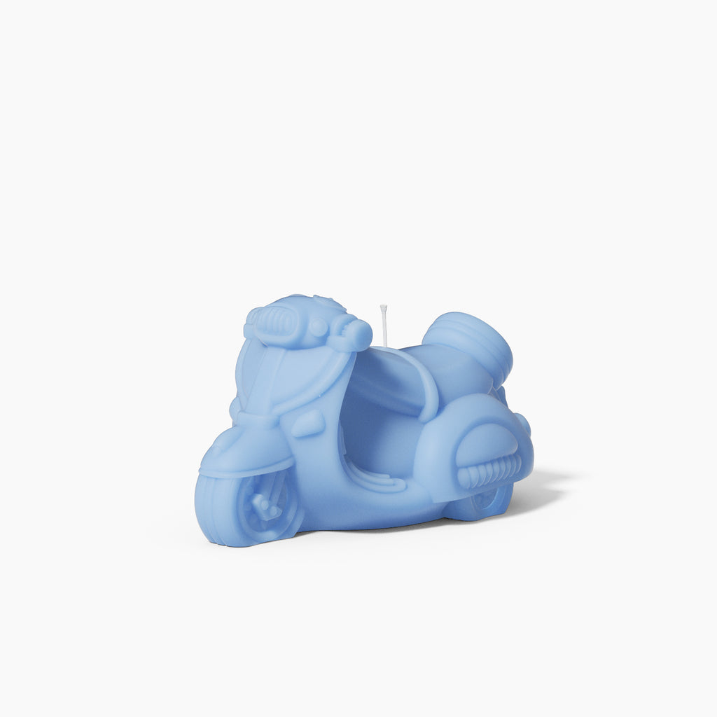 Blue motorcycle-shaped candle made using silicone molds, designed by Boowan Nicole.