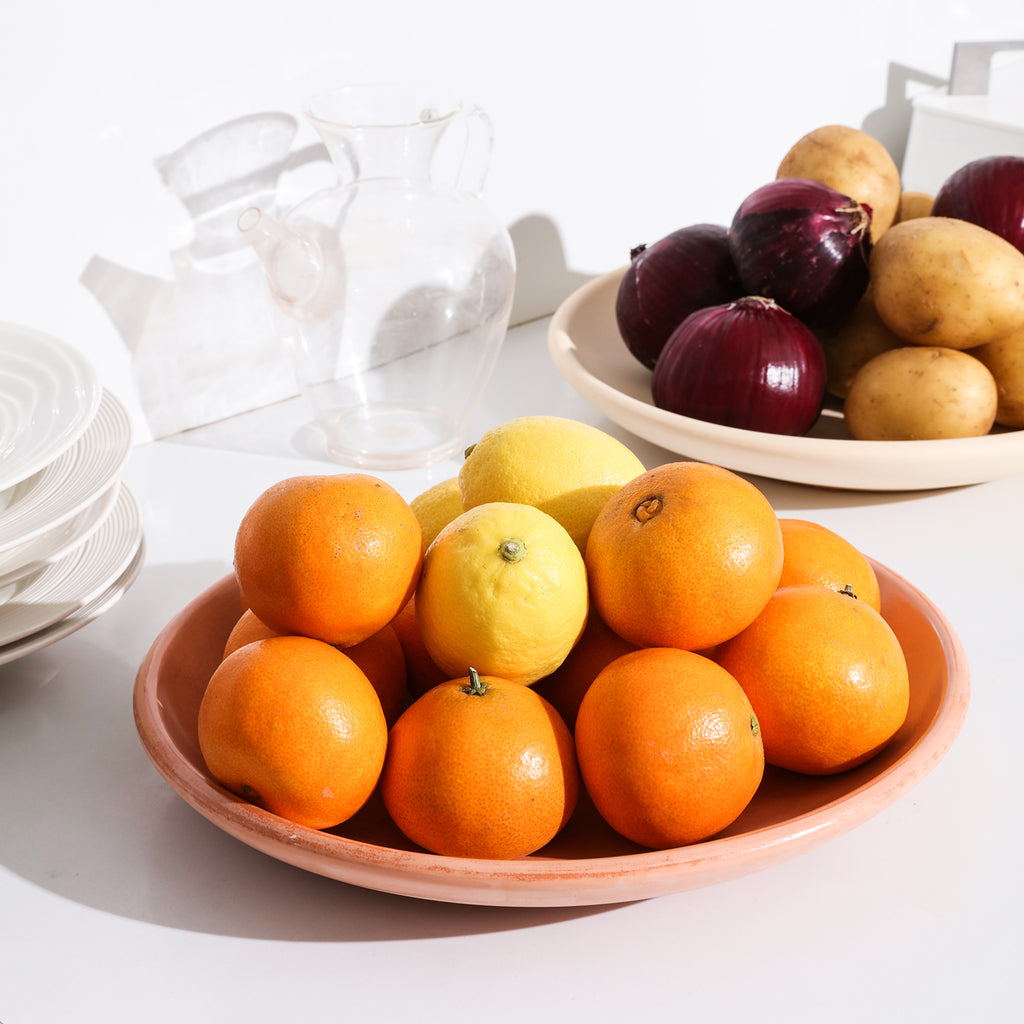 Oranges and lemons are placed on a tray made using a tray mold.