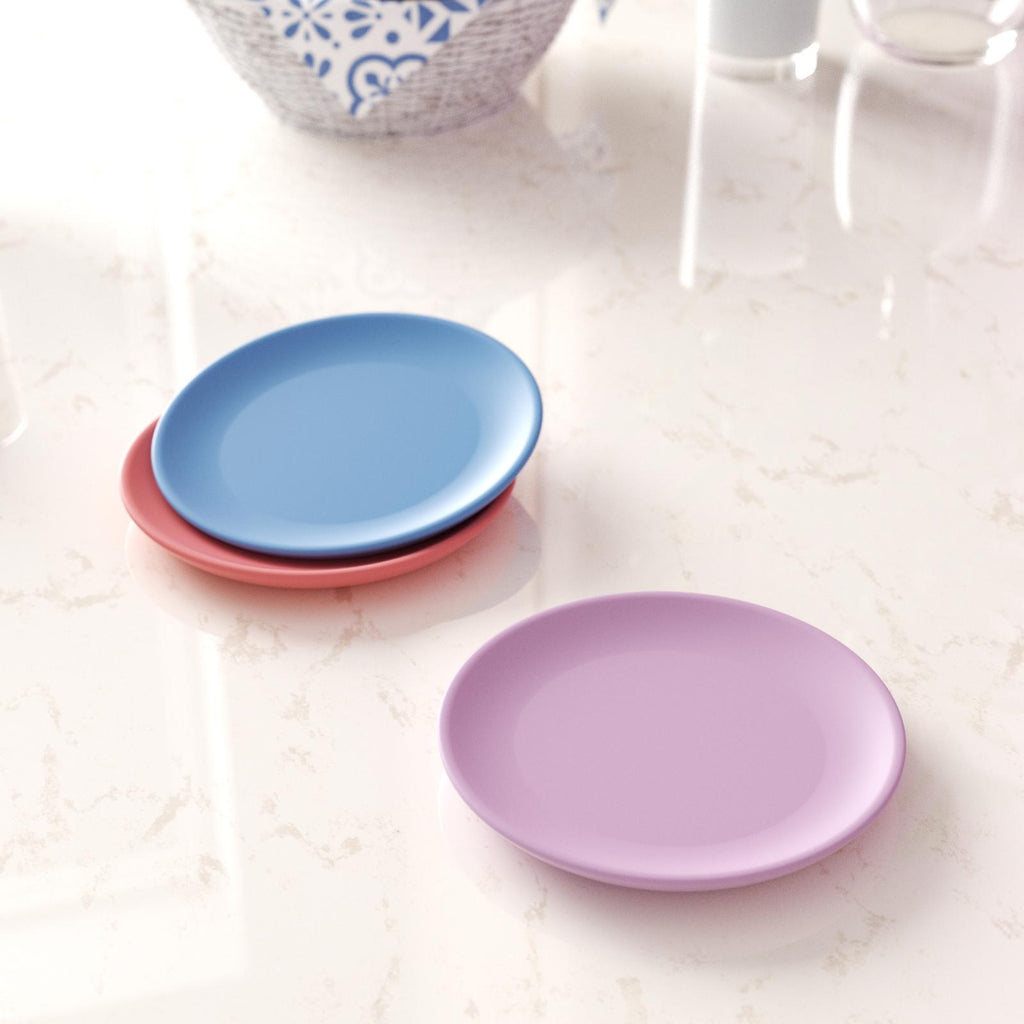 A display featuring three impeccably crafted round trays, with a striking composition of two trays elegantly stacked.