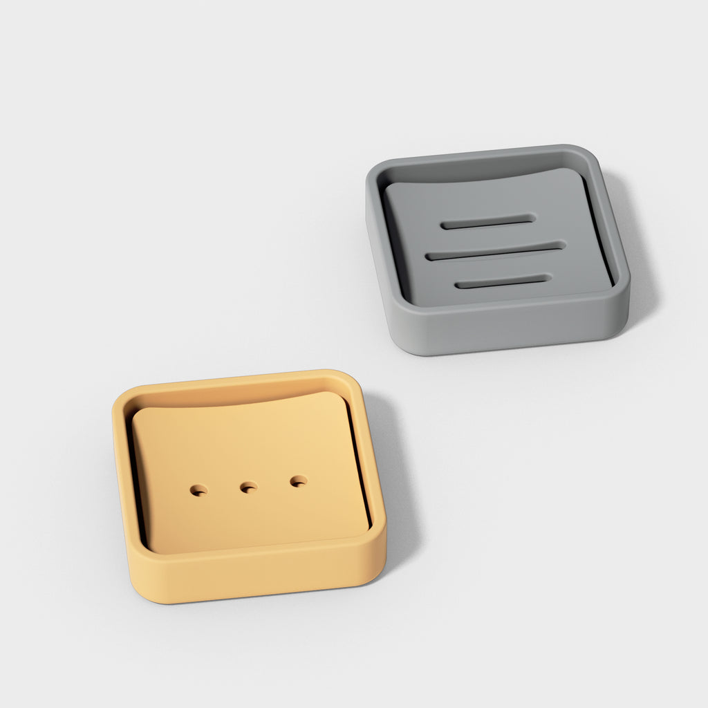 Gray and yellow square soap box with a minimalist design.