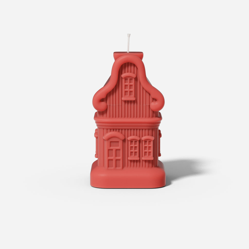 Red house candle made from silicone mold, designed by Boowan Nicole.