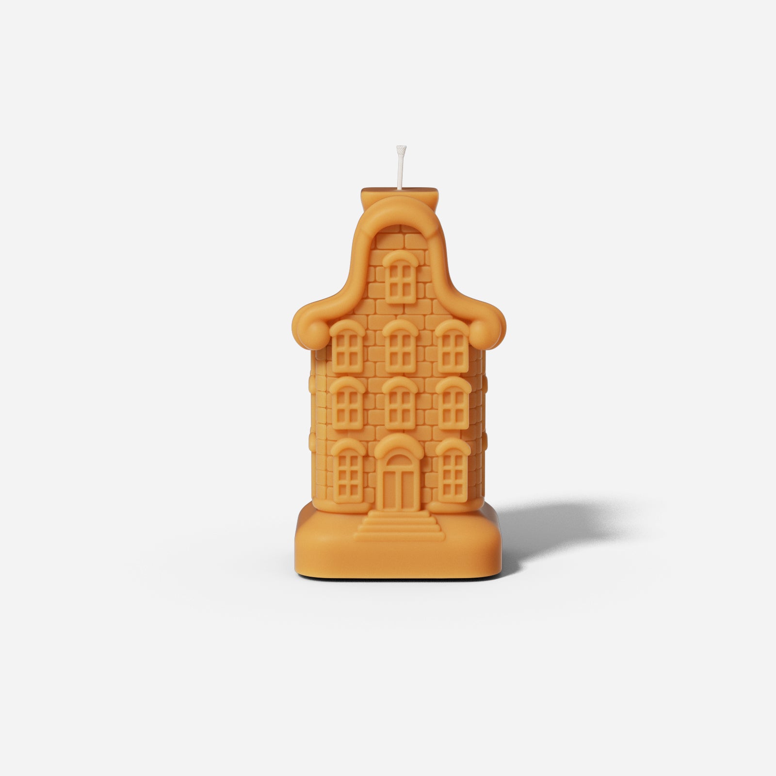 Nine window house candle made using silicone molds.