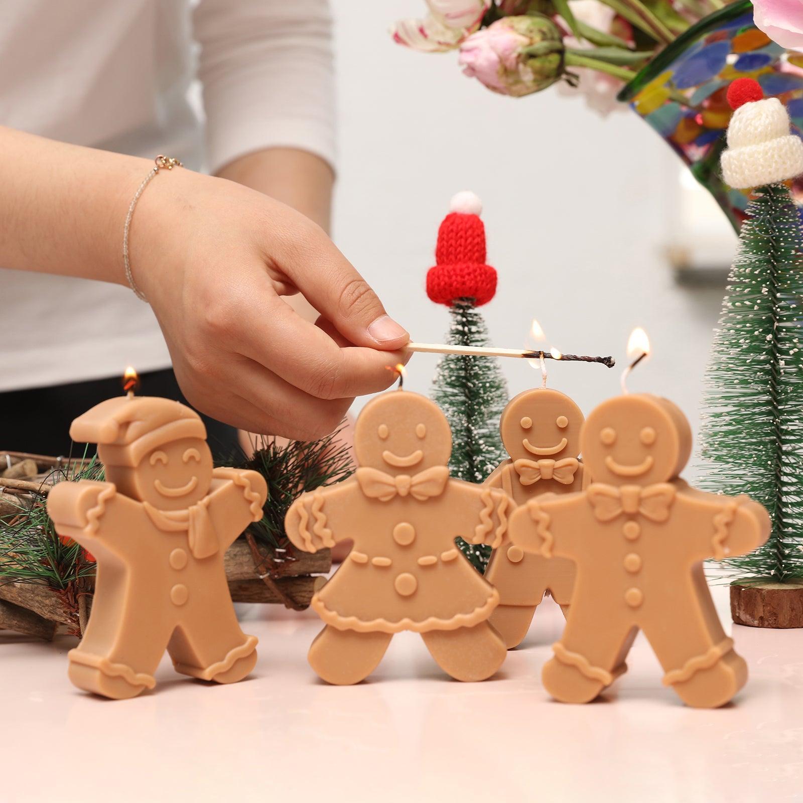 Light the gingerbread man candle on the table, designed by Boowan Nciole.