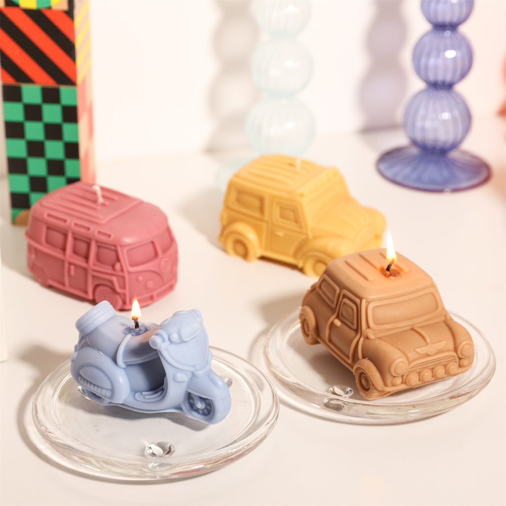 Candles in the shapes of motorcycles, buses, cars and off-road vehicles, designed by Boowan Nicole.