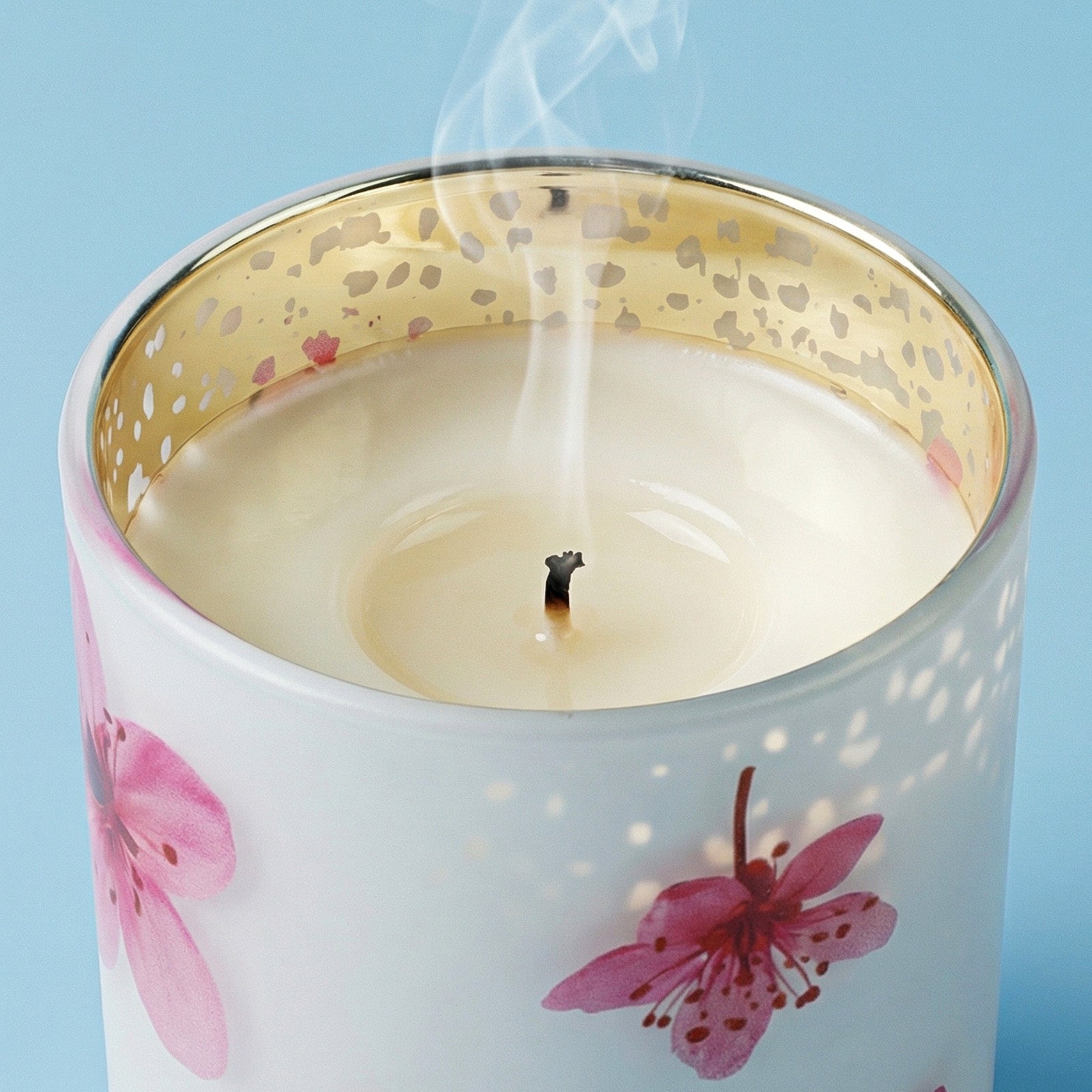 Close-up of Smoldered Wick on Watercolor Cherry Blossom Graphic Gold Speckled Rim Glass Candle Vessel - Boowan Nicole