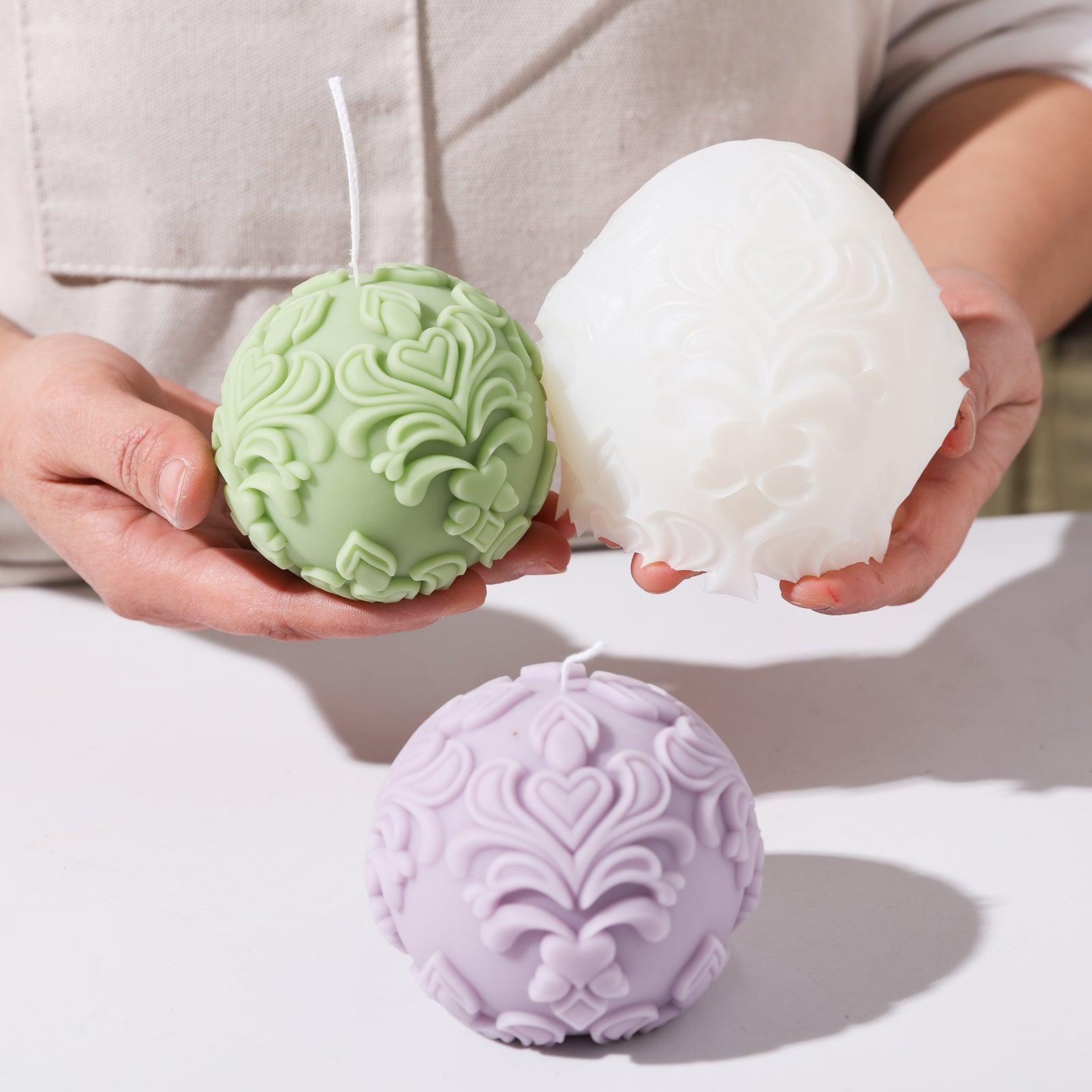Silicone mold paired with a purple sphere patterned relief candle.