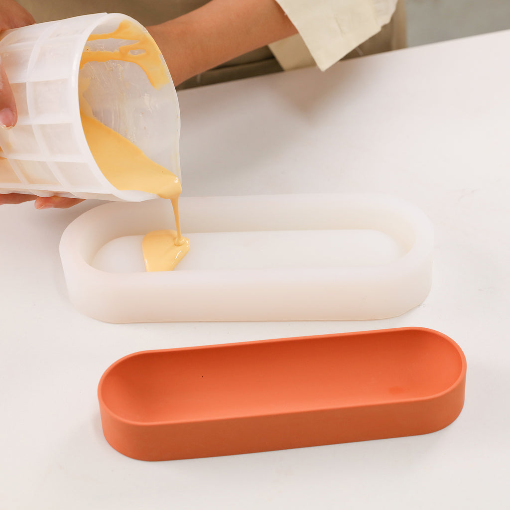 Pour yellow boowannite material into silicone mold to make Long Shaped Pen Organizer-Boowan Nicole