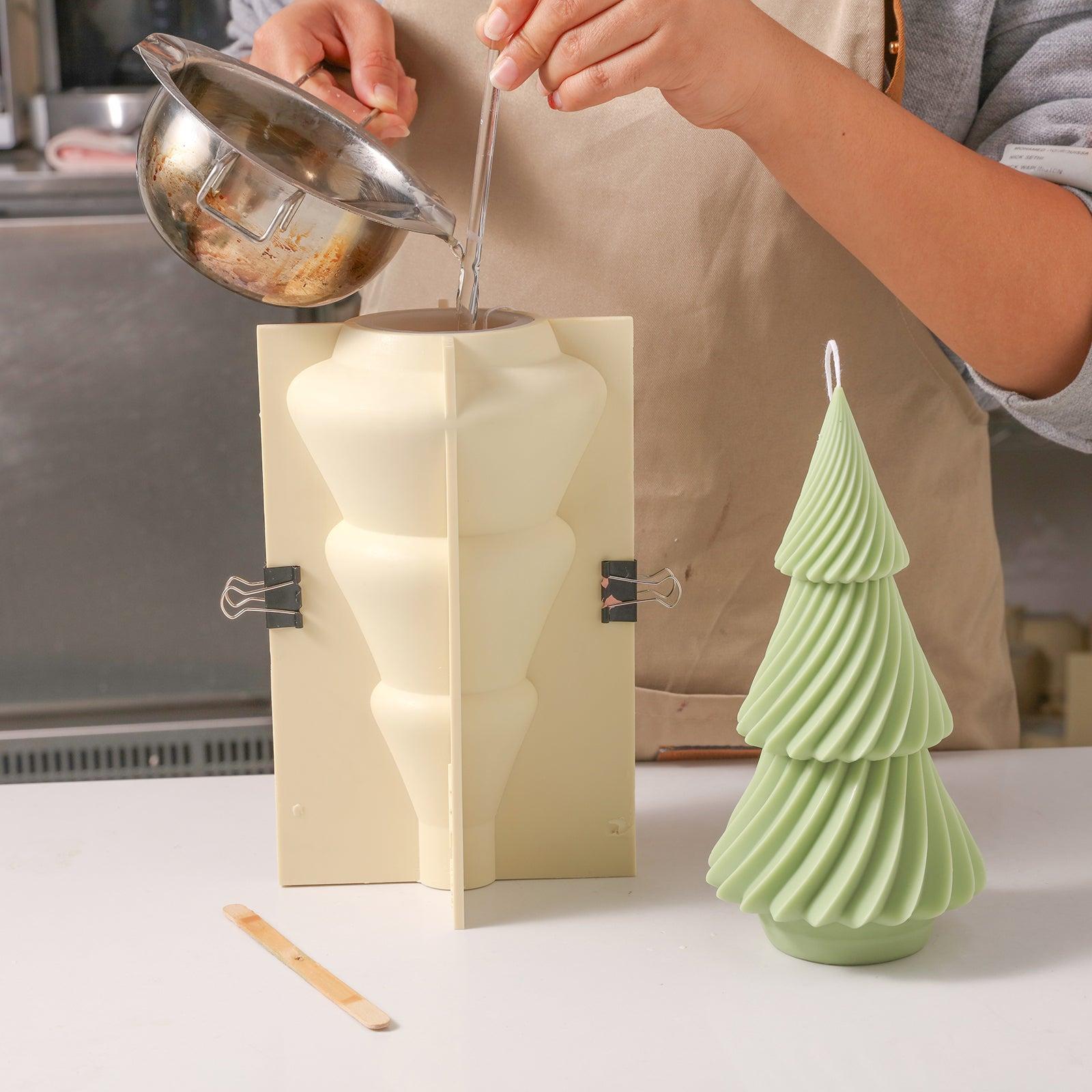 Pour the wax solution into the silicone mold along the glass tube--Boowan Nicole