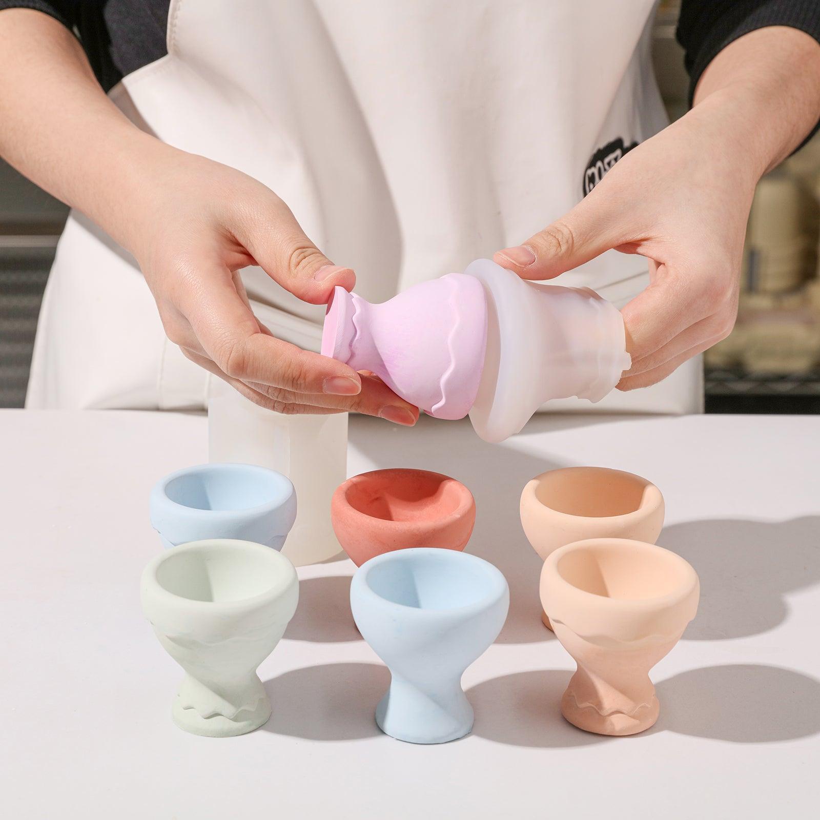 Egg cups being demolded from the silicone mold.