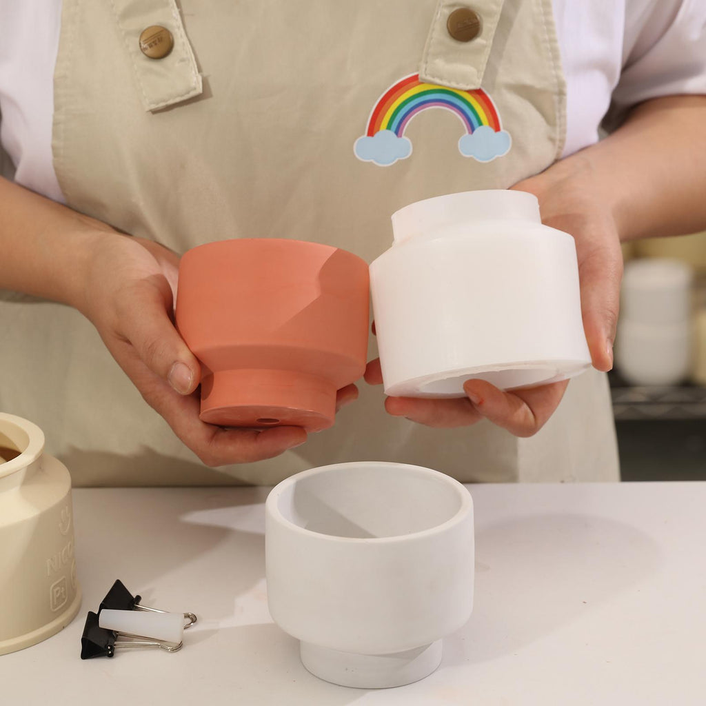 Handheld showing Concrete Plant Pot and corresponding white silicone mold -Boowan Nicole