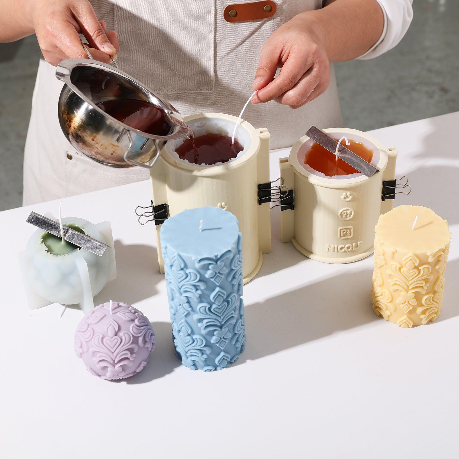 Demonstrating the process of making relief candles using silicone molds.