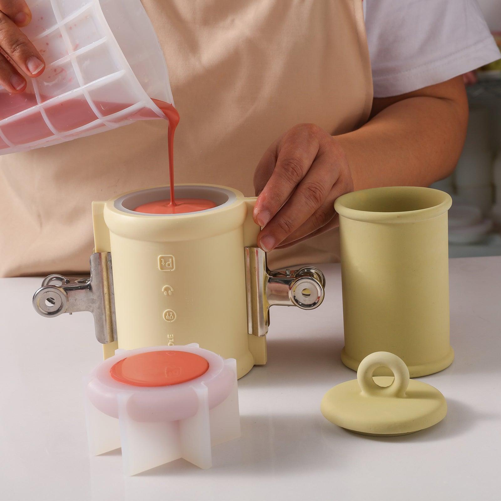 Pour red Boowannite material into silicone mold to make Cylinder Tall Candle Jar with Ring Handle Lid-Boowan Nicole