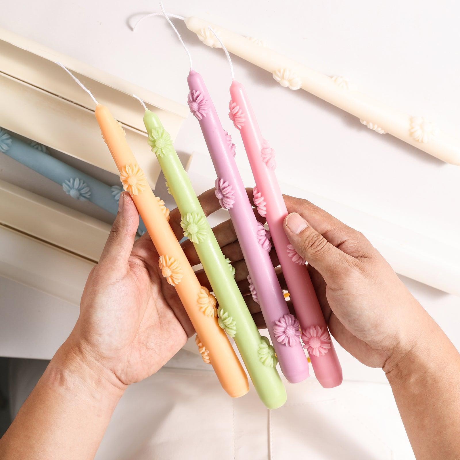 Holding yellow, green, purple and pink tapered candles, cute shape, family decoration, designed by Boowan Nicole.