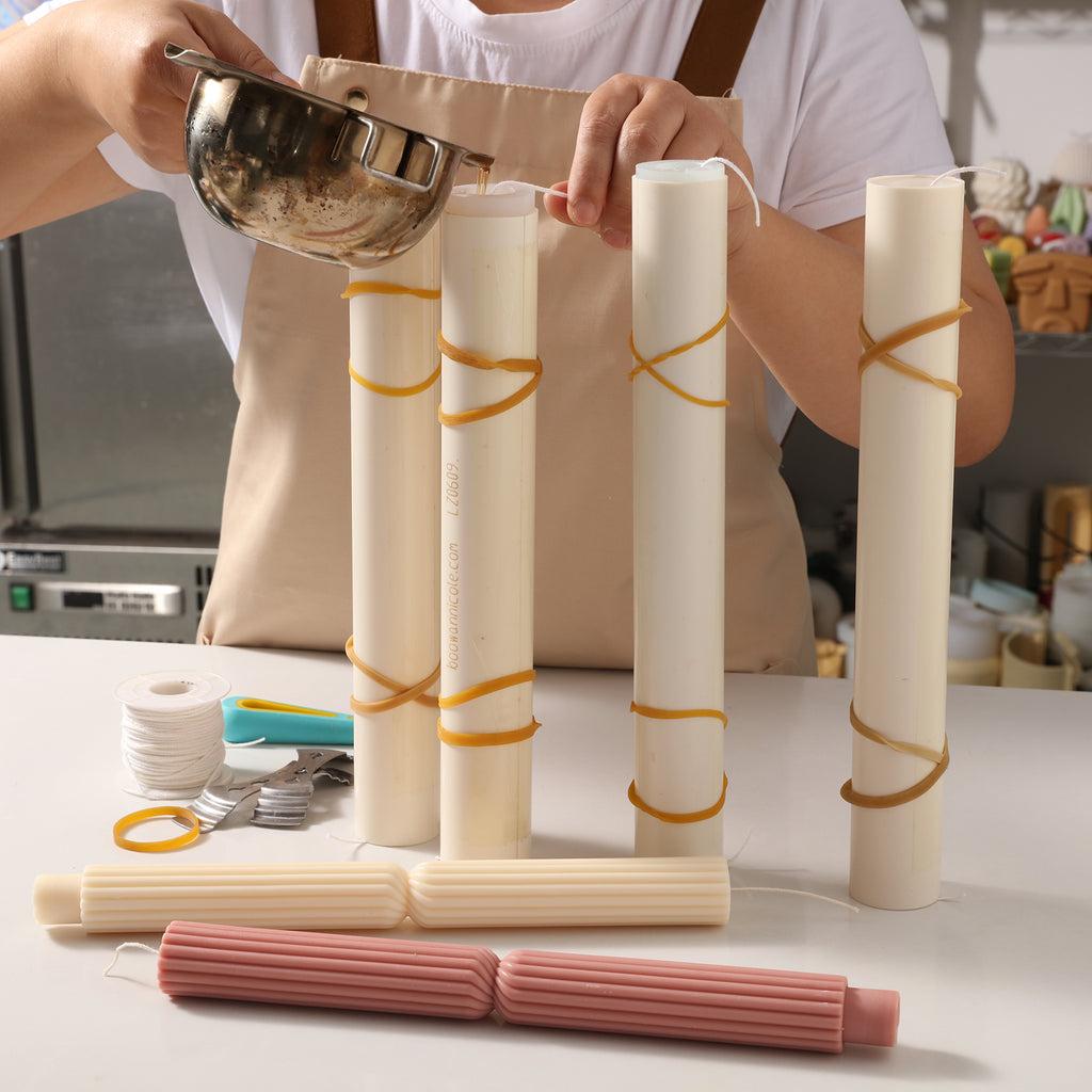 Pour liquid wax into silicone mold to make Doric Pillar Taper Candle -Boowan Nicole