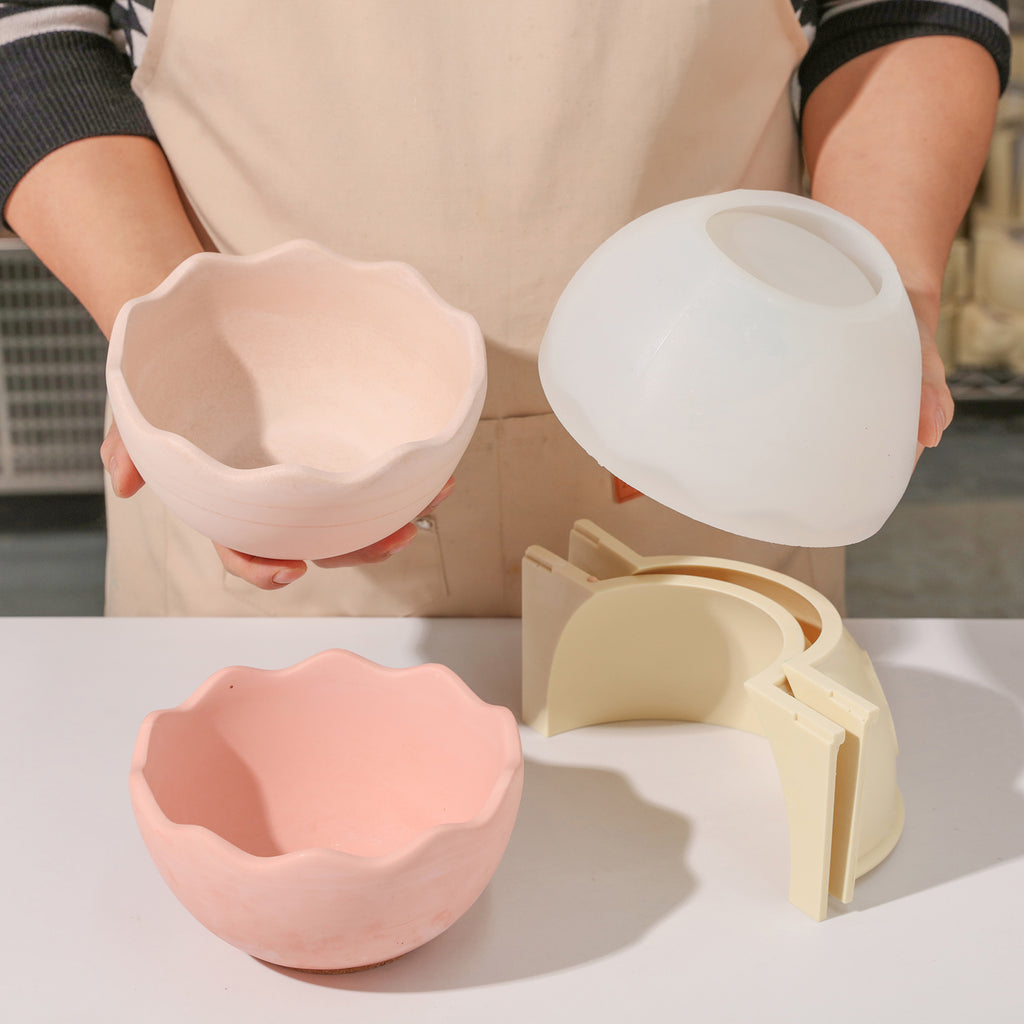 Hand showing eggshell bowl and silicone mold