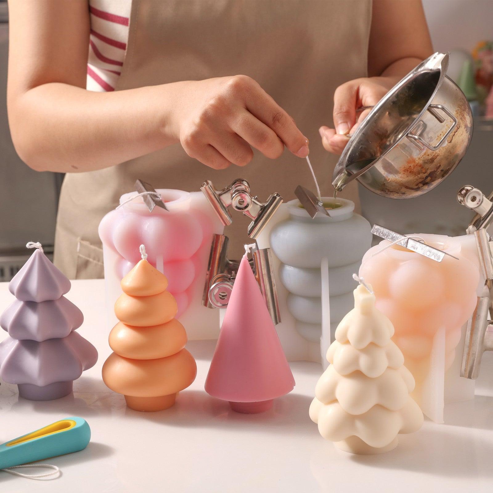 Pour liquid wax into silicone mold to make Glowing Christmas Tree Candle-Boowan Nicole