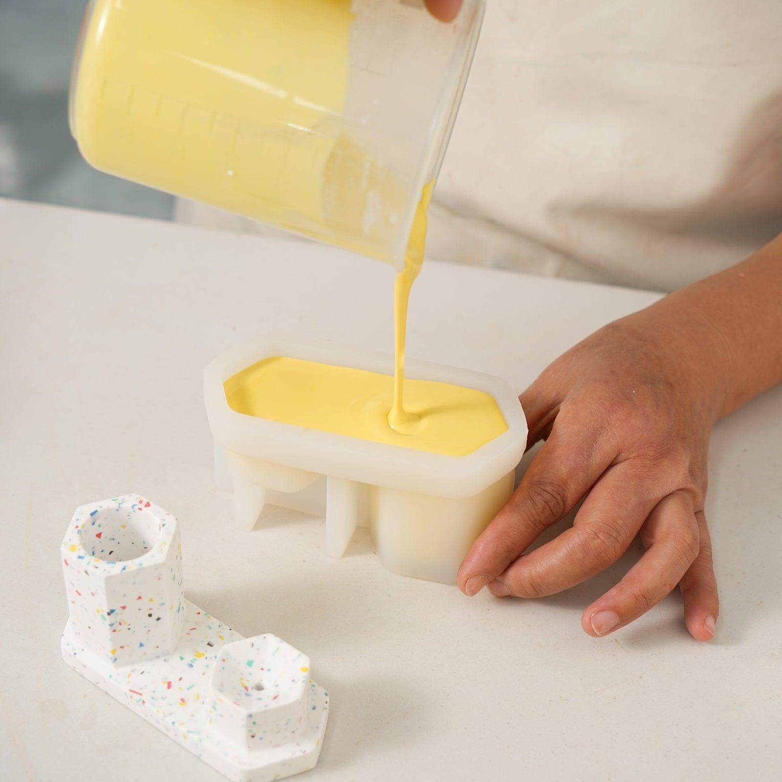 Pour yellow boowannite material into white silicone mold to make Hexagon Incense Holder-Boowan Nicole