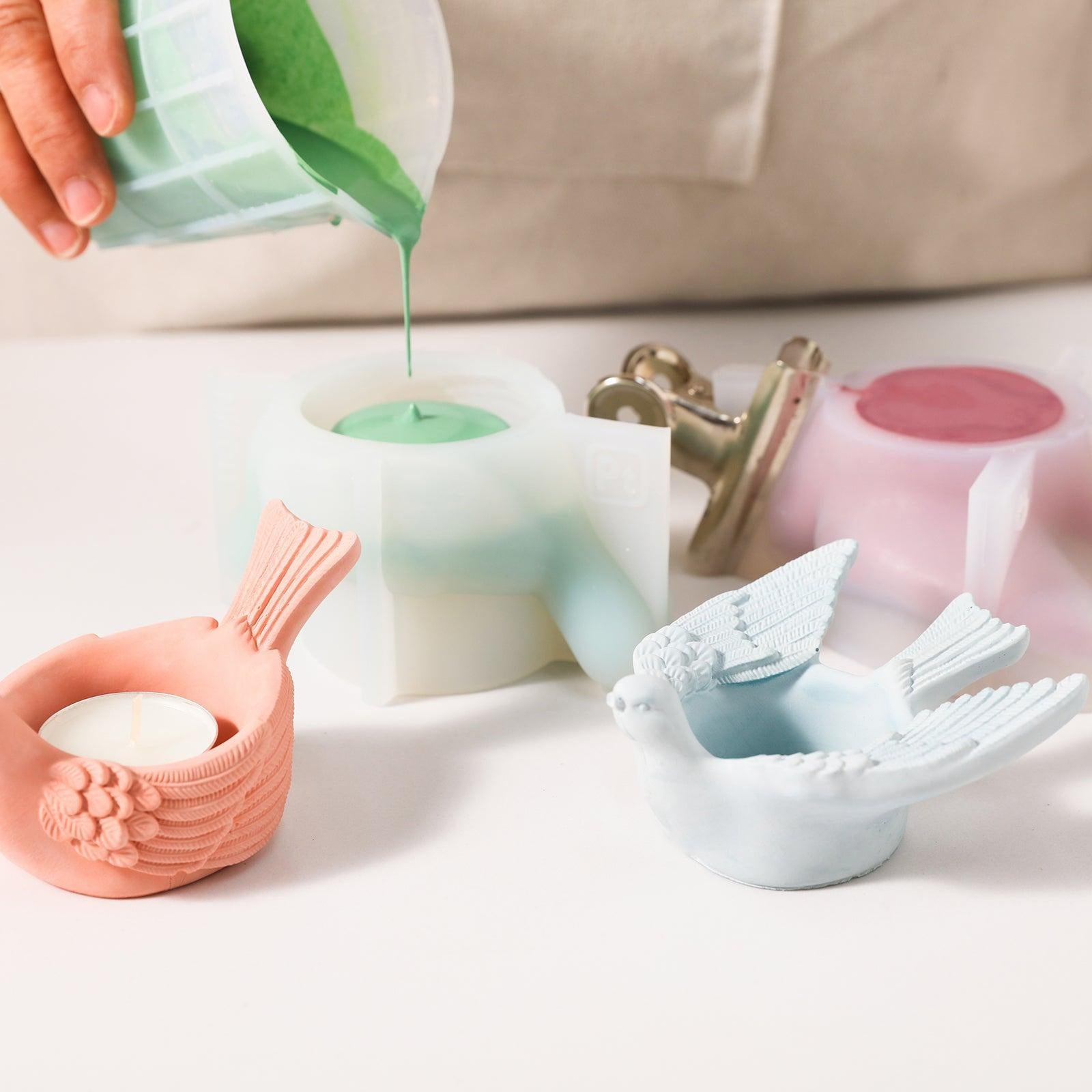 Capturing the process of creating candle holders using silicone molds, highlighting the hands-on craftsmanship.