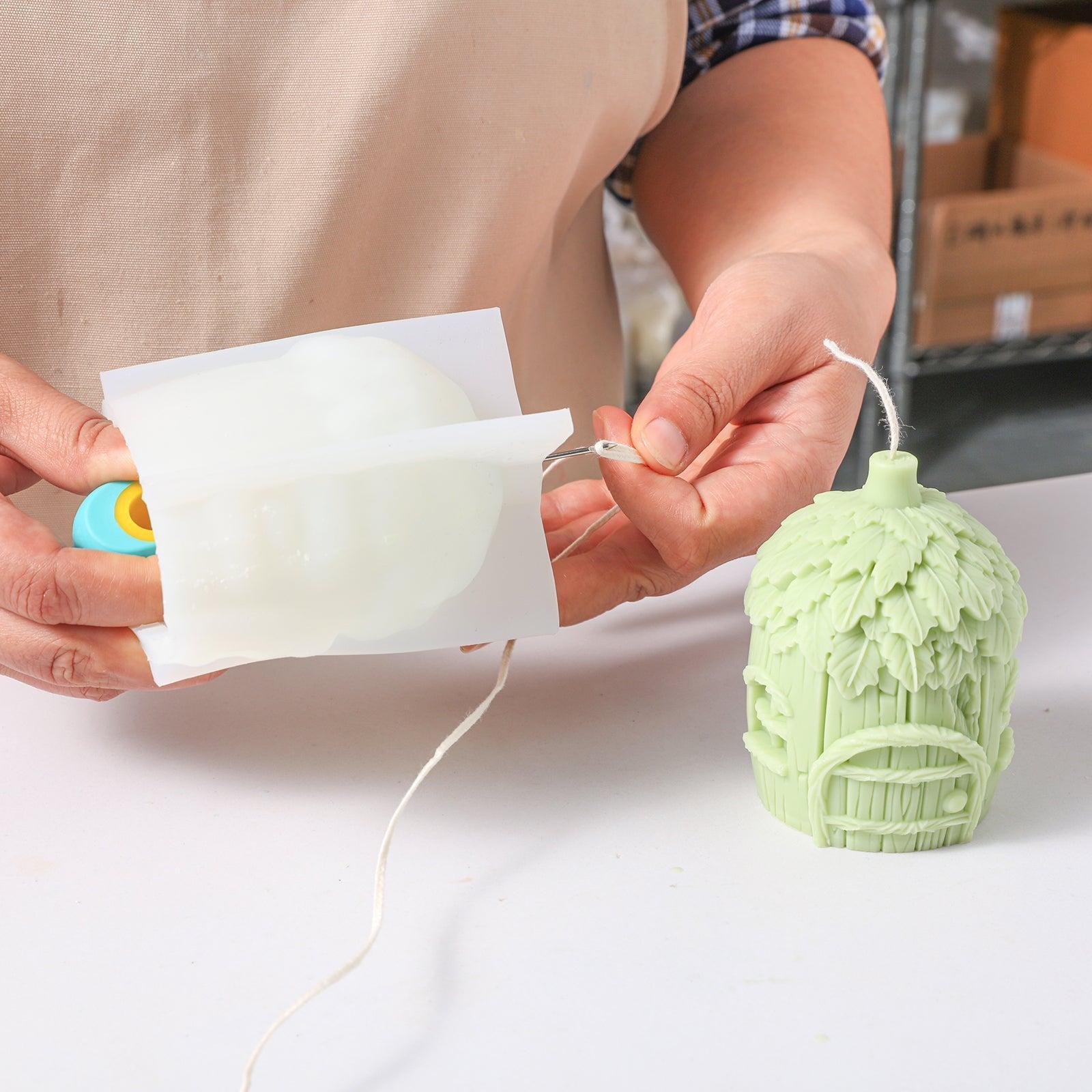 Use a stringing tool to thread candle wicks through pilot holes - Boowan Nicole